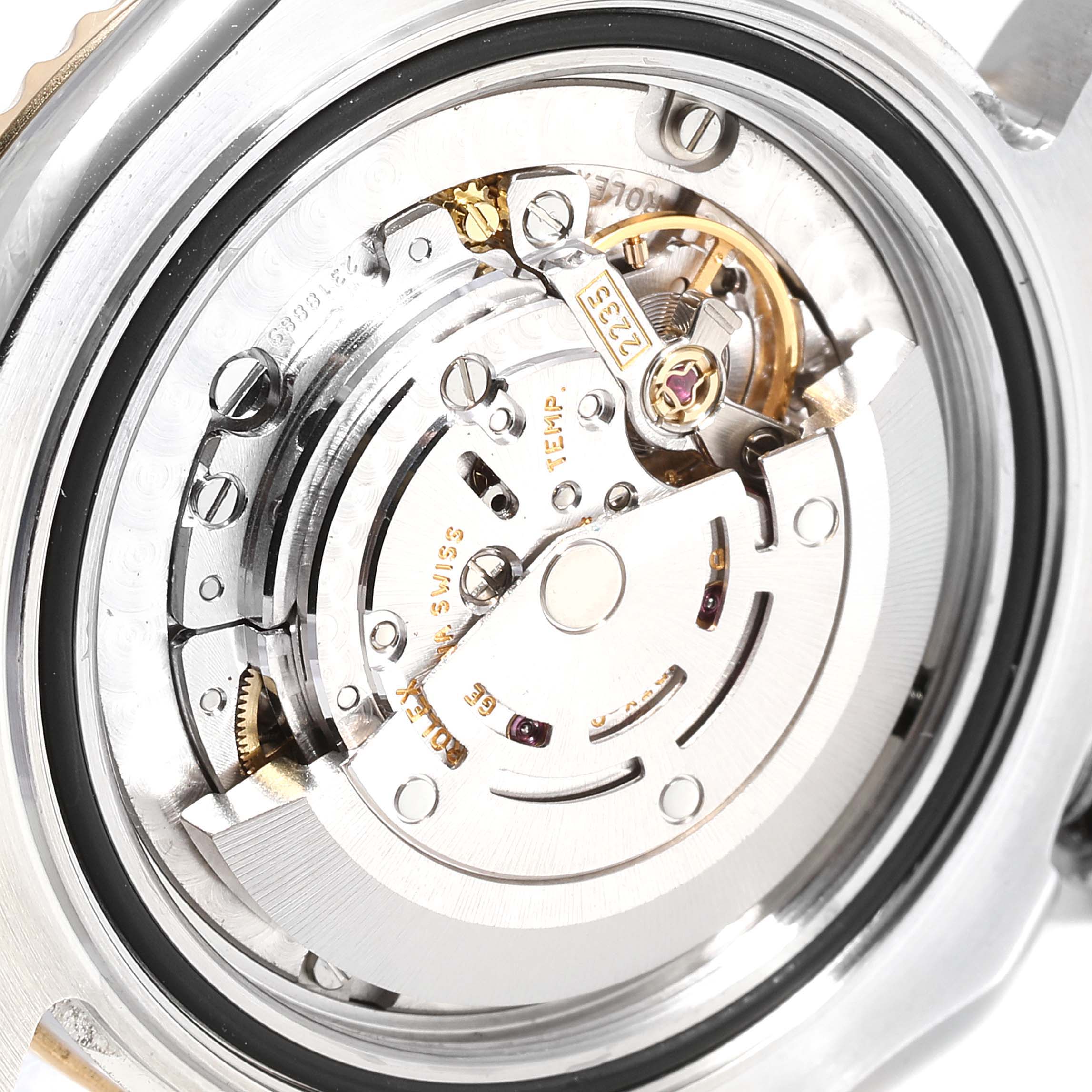 This image shows the movement and inner mechanism of a Rolex Yacht-Master 168623 Men's Steel and Gold (two tone) Blue Dial 168623 Men's Steel and Gold (two tone) Blue Dial watch from a rear angle.