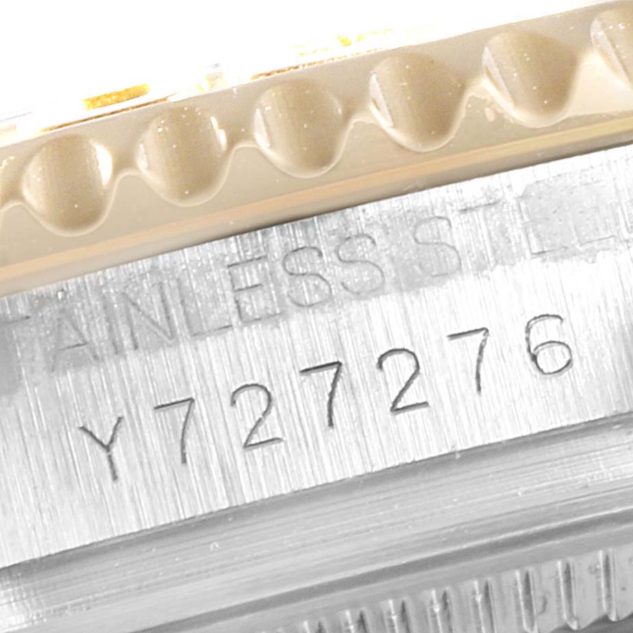 This close-up image shows the engraved serial number on the stainless steel case of a Rolex Yacht-Master 168623 Men's Steel and Gold (two tone) White Dial 168623 Men's Steel and Gold (two tone) White Dial watch.