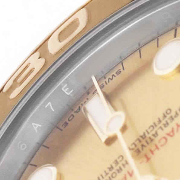 The image focuses on the Rolex Yacht-Master 168623 Men's Steel and Gold (two tone) Champagne Dial's dial and bezel, showcasing the gold-colored details and markers.