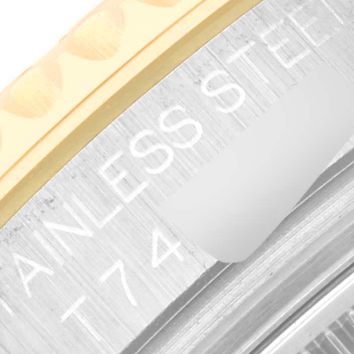 The image shows a close-up of the side engraving of a Rolex Yacht-Master 68623 Men's Steel and Gold (two tone) White Dial 68623 Men's Steel and Gold (two tone) White Dial watch, highlighting the "STAINLESS STEEL" text.