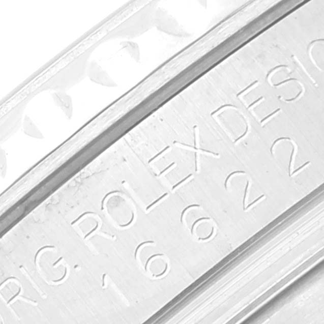 This close-up image shows the side of a Rolex Yacht-Master 16622 Men
s Stainless Steel Silver Dial 16622 Men
s Stainless Steel Silver Dial watch with parts of the bezel and engraved model number.