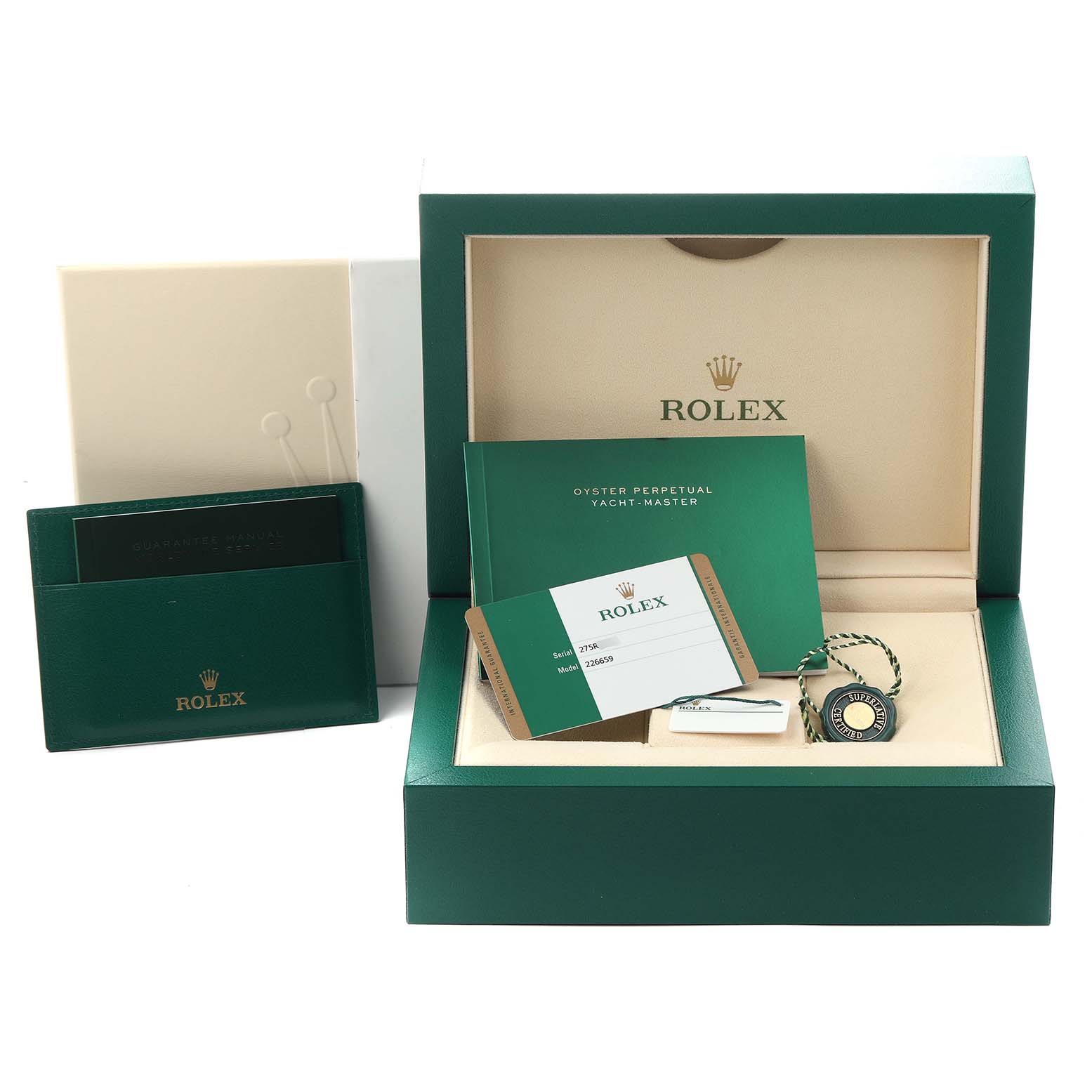 The image shows the packaging and accessories for a Rolex Yacht-Master 226659 Men
s White Gold Black Dial 226659 Men
s White Gold Black Dial, including a box, card, booklet, and tag.