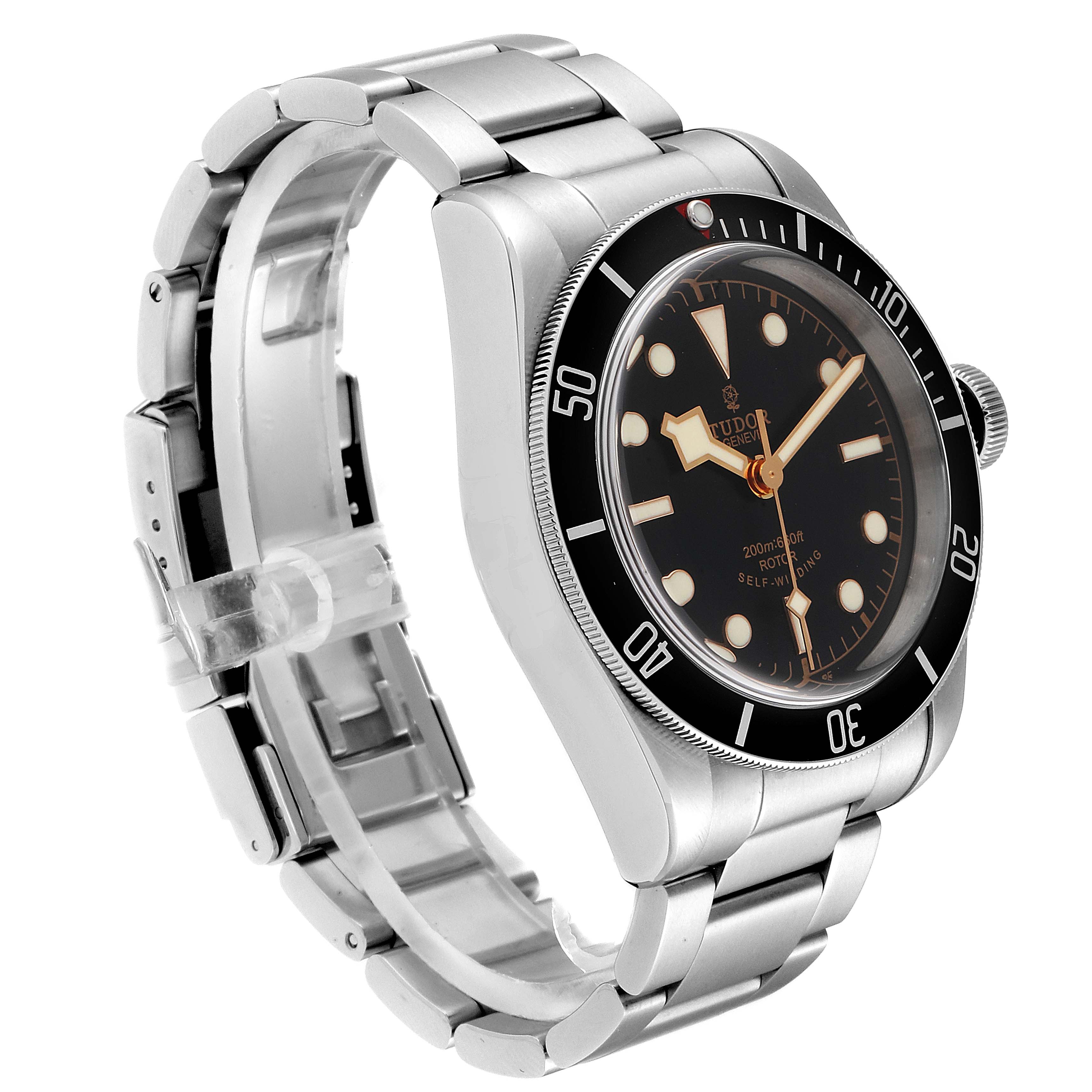 The Tudor Heritage Black Bay 79220R Men
s Stainless Steel Black Dial 79220R Men
s Stainless Steel Black Dial watch is shown at a three-quarter angle, displaying the face, bezel, crown, and bracelet.