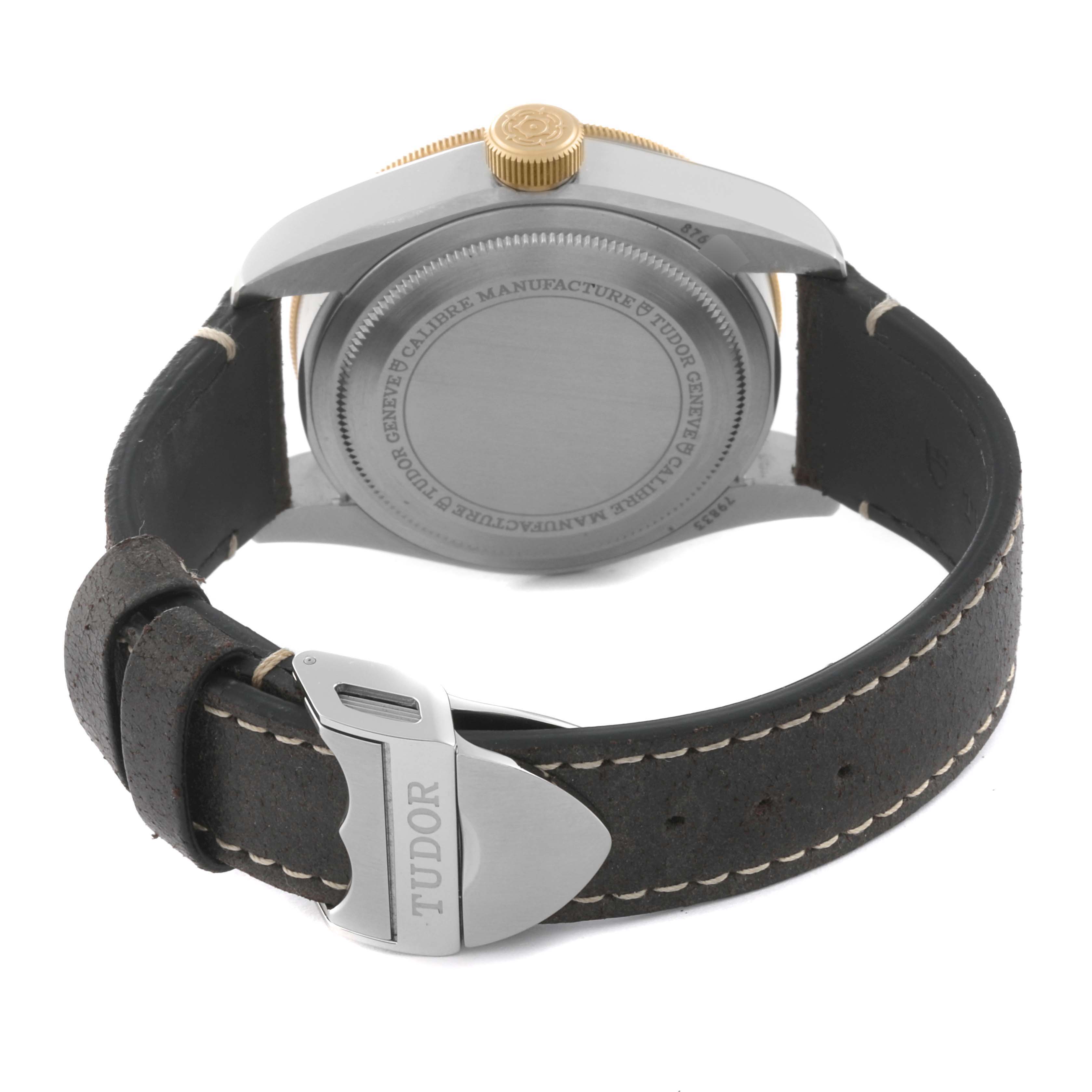 This image shows the back case and leather strap of the Tudor Heritage Black Bay 79833MN Men's Stainless Steel Black Dial 79833MN Men's Stainless Steel Black Dial watch, positioned at a rear angle.