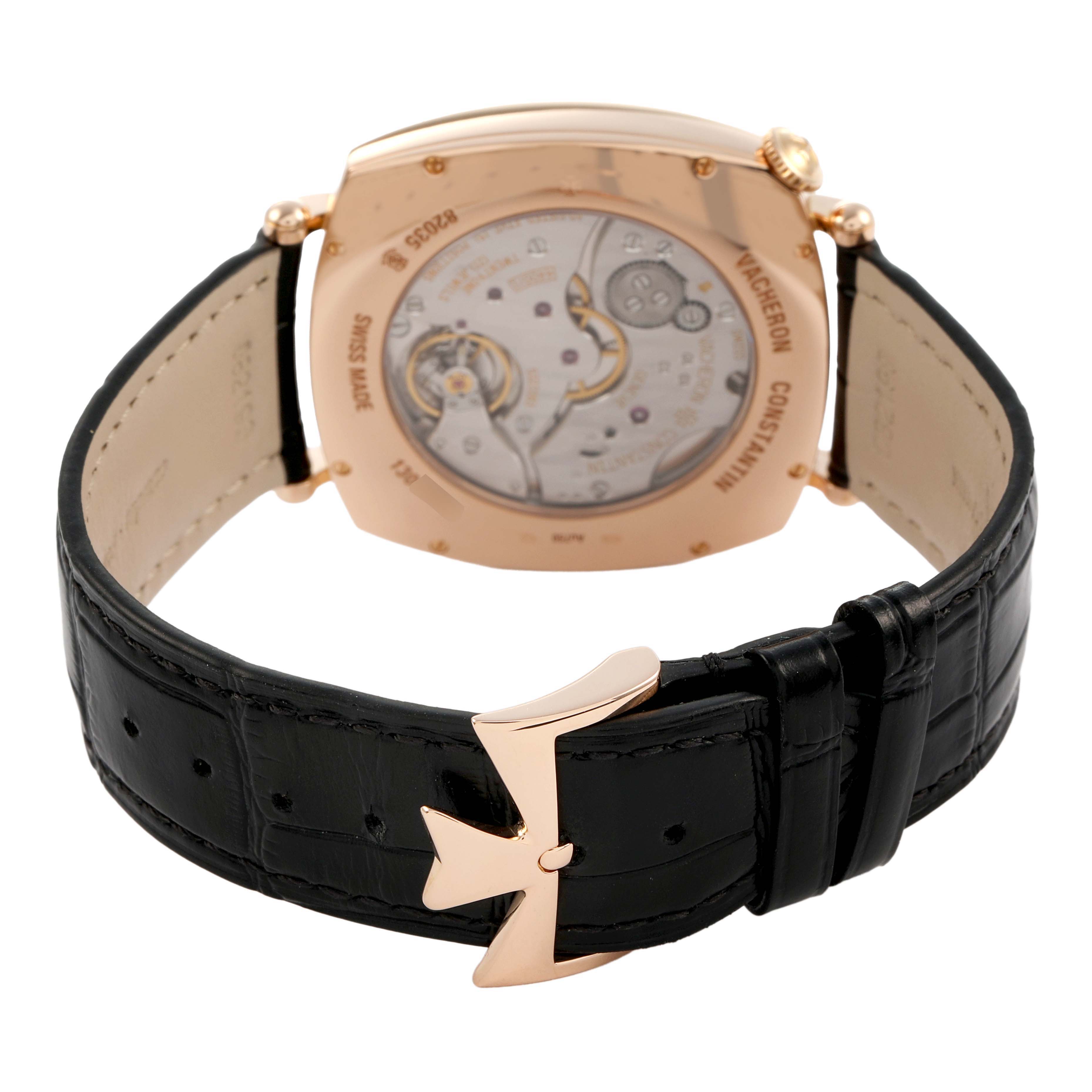 The image shows the back view of a Vacheron Constantin Historiques 82035/000R-9359 Men's Rose Gold Silver Dial model, highlighting its open case back and leather strap with a distinct buckle.