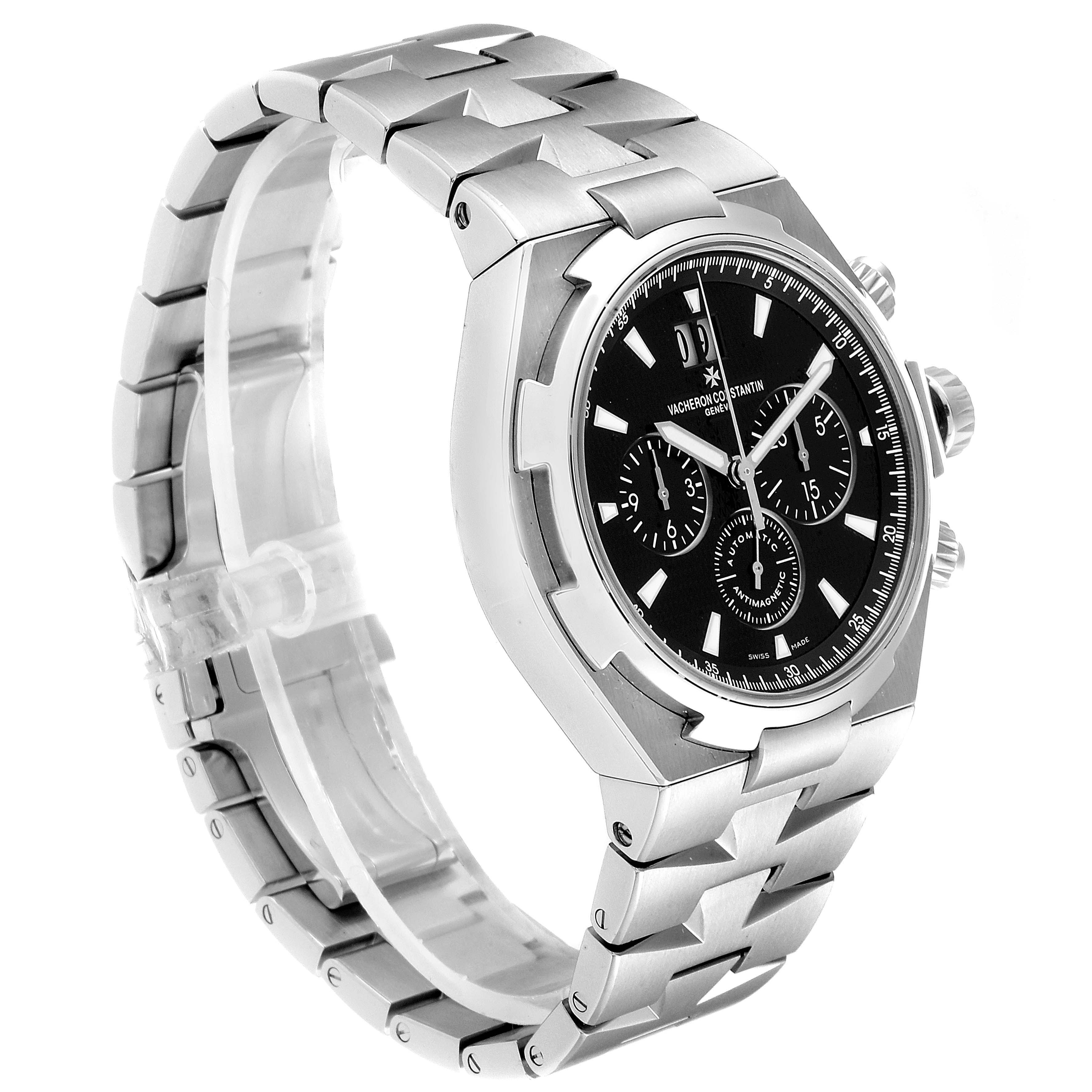 The image shows a Vacheron Constantin Overseas 49150.B01A.9097 Men's Stainless Steel Black Dial 49150.B01A.9097 Men's Stainless Steel Black Dial model watch from a side angle, displaying its face, bezel, crown, and bracelet.