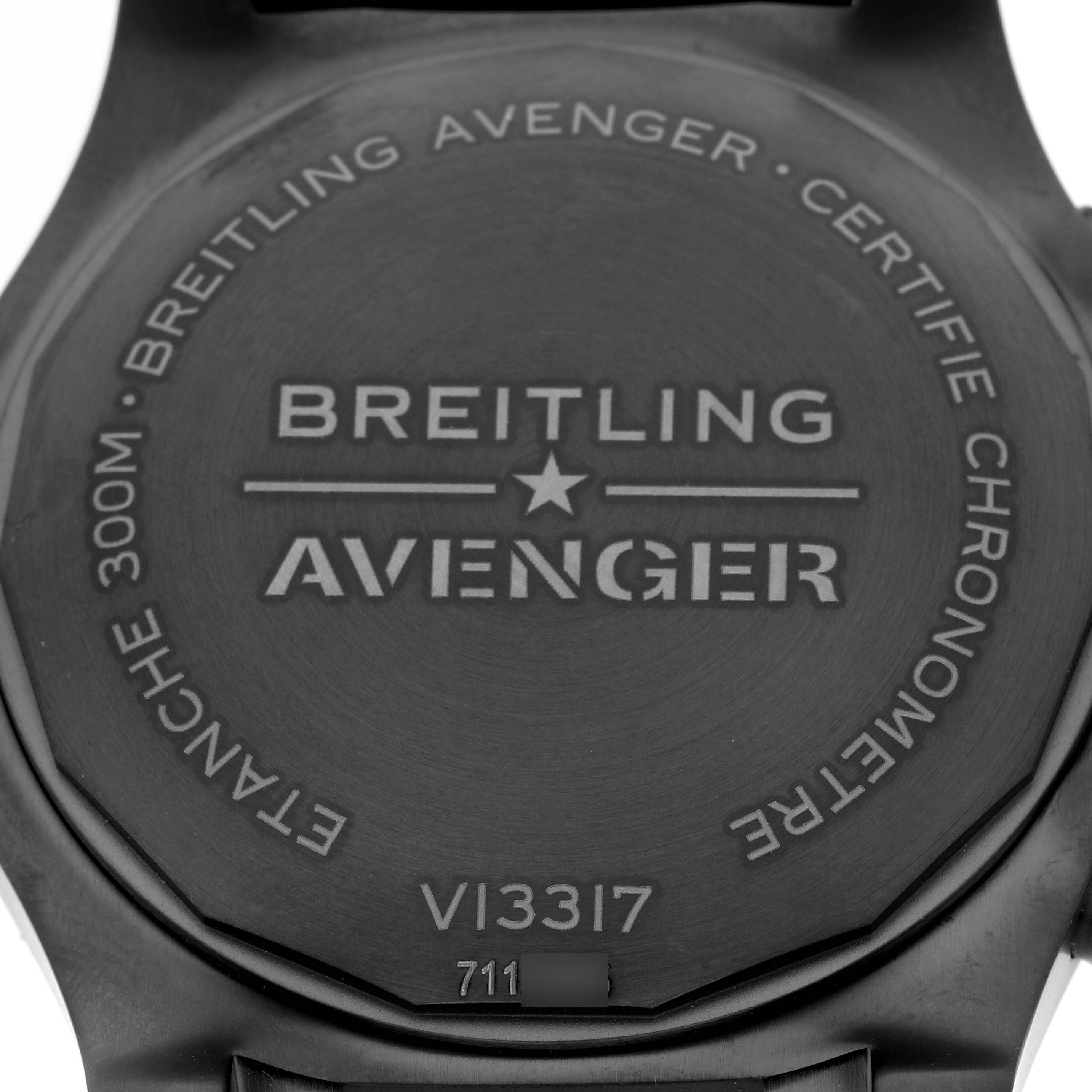 The image shows the back case of a Breitling Avenger V13317 Men's Titanium Black Dial V13317 Men's Titanium Black Dial model watch, detailing the model number and branding.