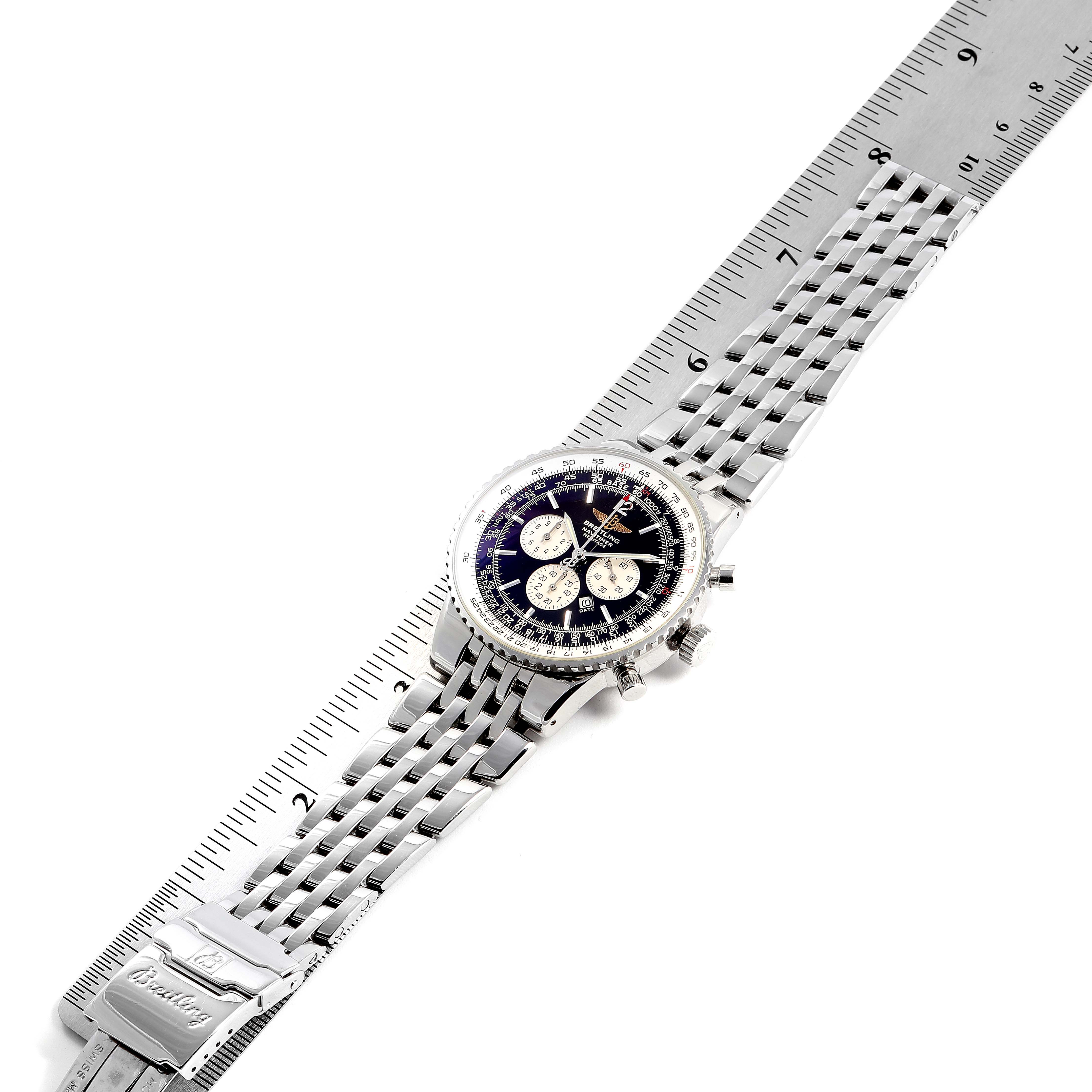The Navitimer by Breitling is shown from a top view, revealing its face, bezel, crown, pushers, and metal bracelet.