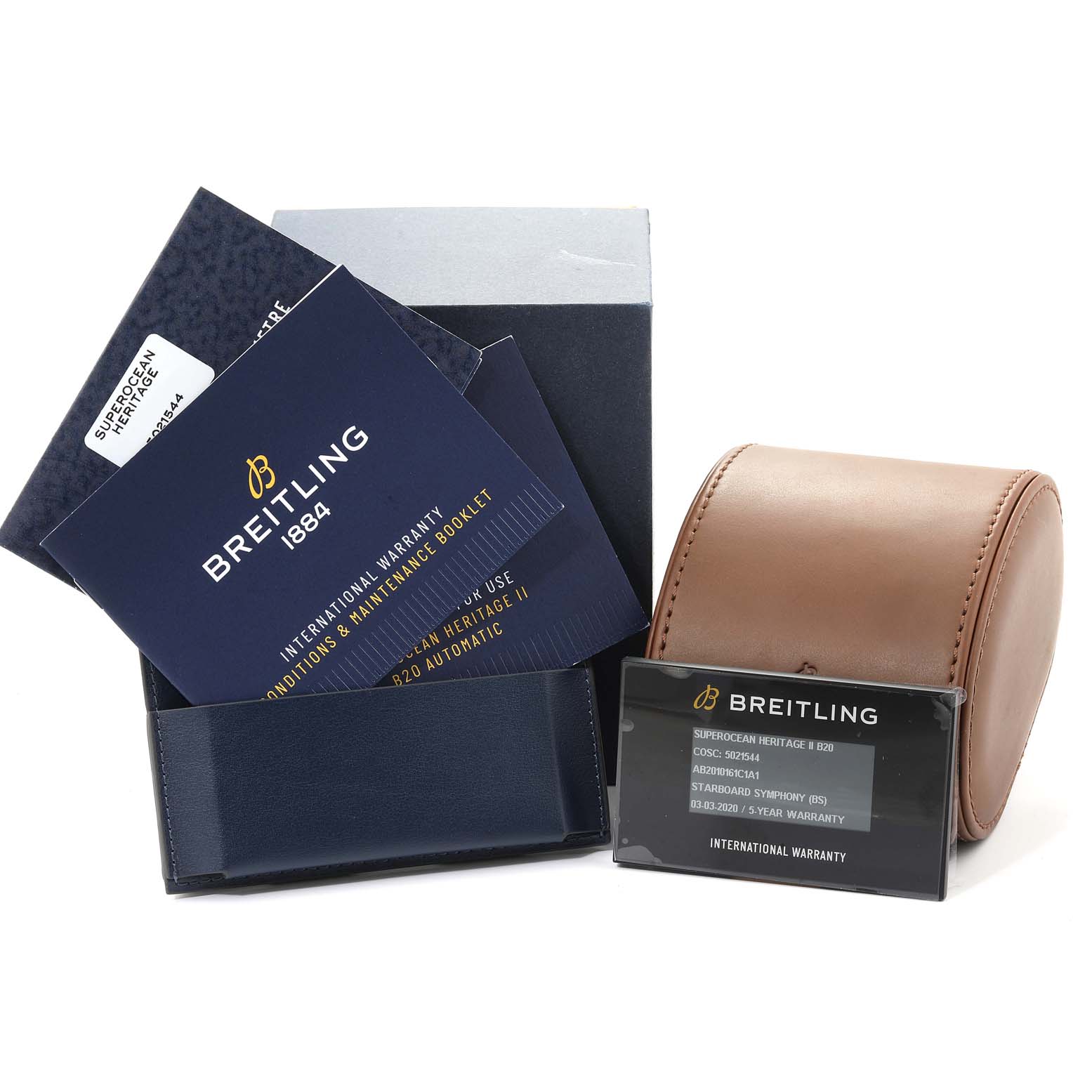 The image shows the packaging and accessories for a Breitling Superocean AB2010161C1A1 Men
s Stainless Steel Blue Dial AB2010161C1A1 Men
s Stainless Steel Blue Dial model, including warranty cards, booklets, and a leather case.