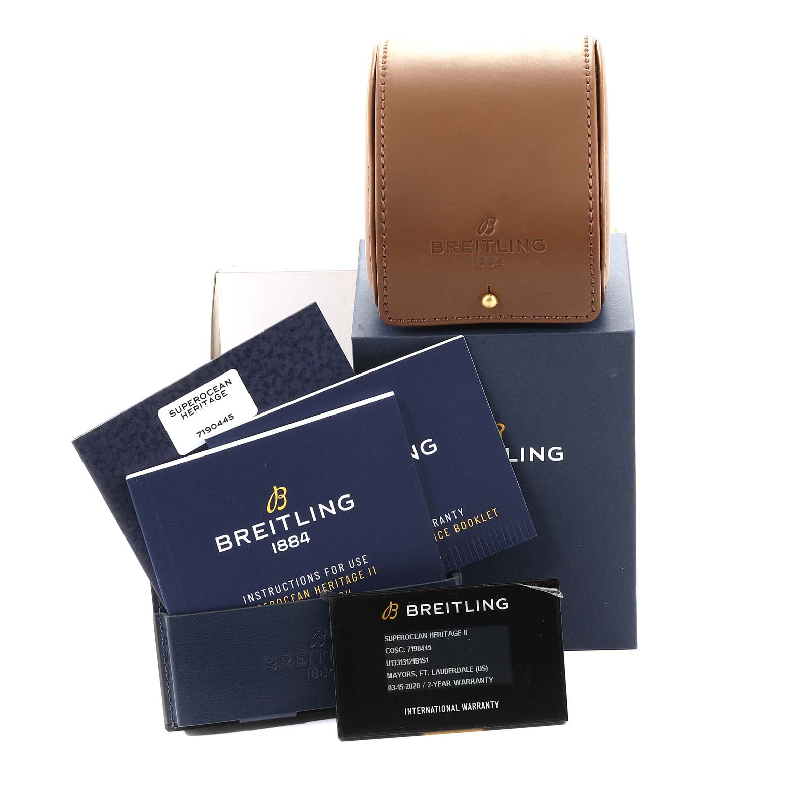 The image shows Breitling Superocean U1331312/BG50/279S/A20D.4 Men's Stainless Steel Black Dial U1331312/BG50/279S/A20D.4 Men's Stainless Steel Black Dial watch accessories, including a warranty booklet, instruction manuals, and a brown leather case.