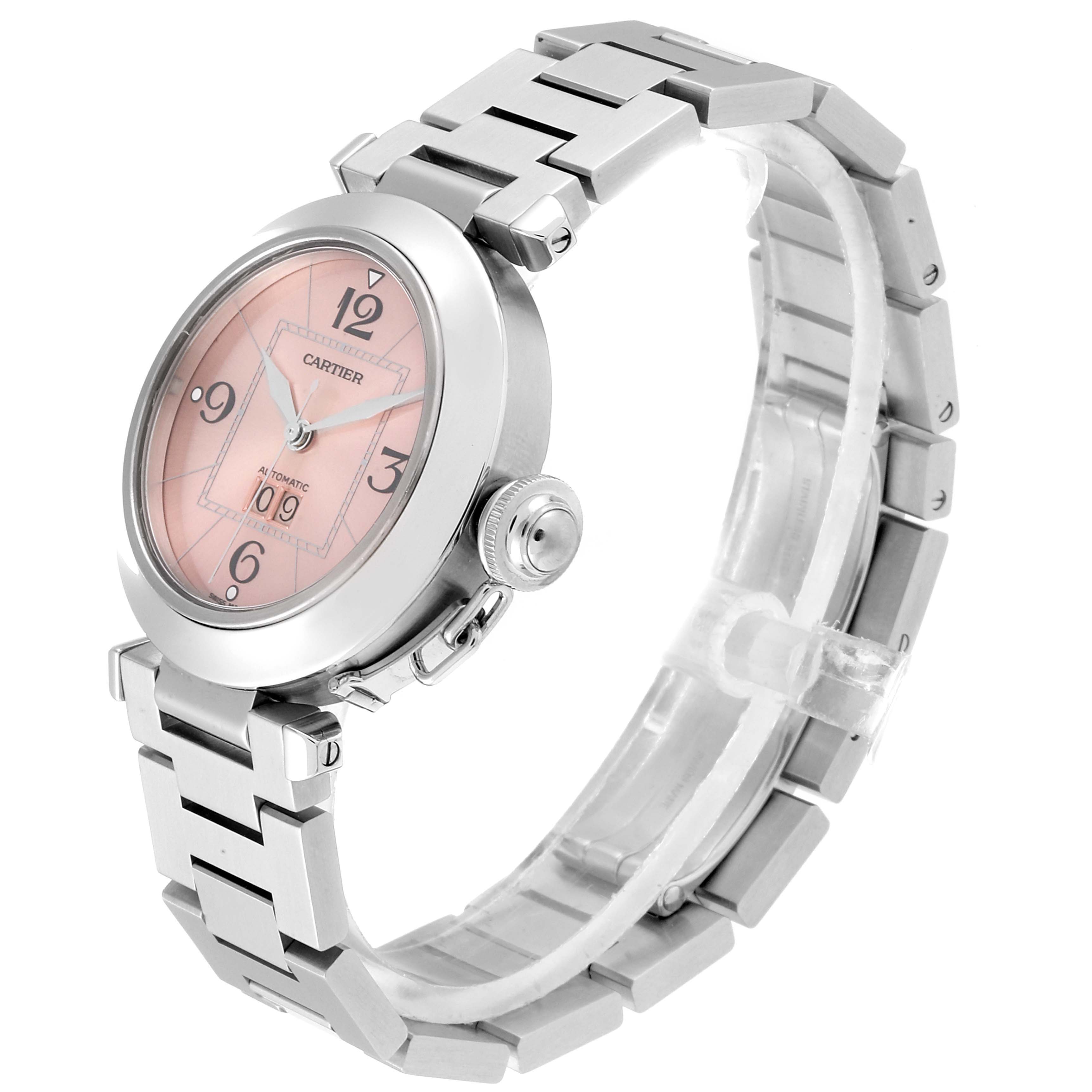 The image shows a Cartier Pasha W31058M7 Women's Stainless Steel Pink Dial W31058M7 Women's Stainless Steel Pink Dial watch at a slight side angle, highlighting its pink dial, crown, and stainless steel bracelet.
