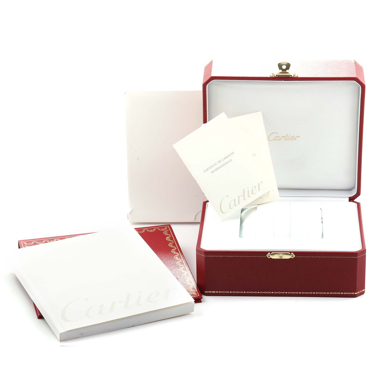 The image shows an open Cartier Pasha W31088U2 Men
s Stainless Steel Black Dial W31088U2 Men
s Stainless Steel Black Dial watch box with manuals and a certificate positioned at a slight angle.