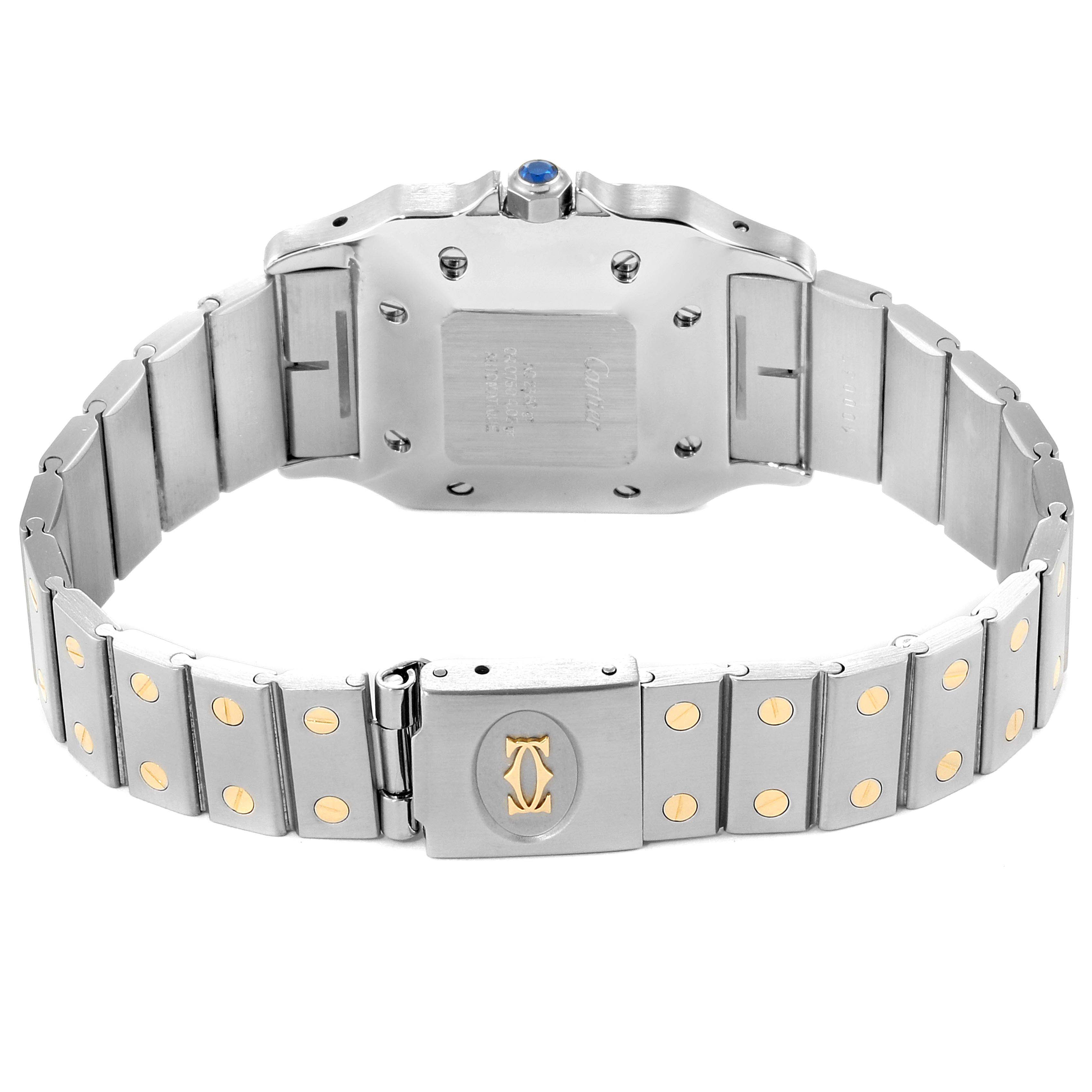 The image shows the backside and bracelet of a Santos model by Cartier, highlighting the clasp and links.