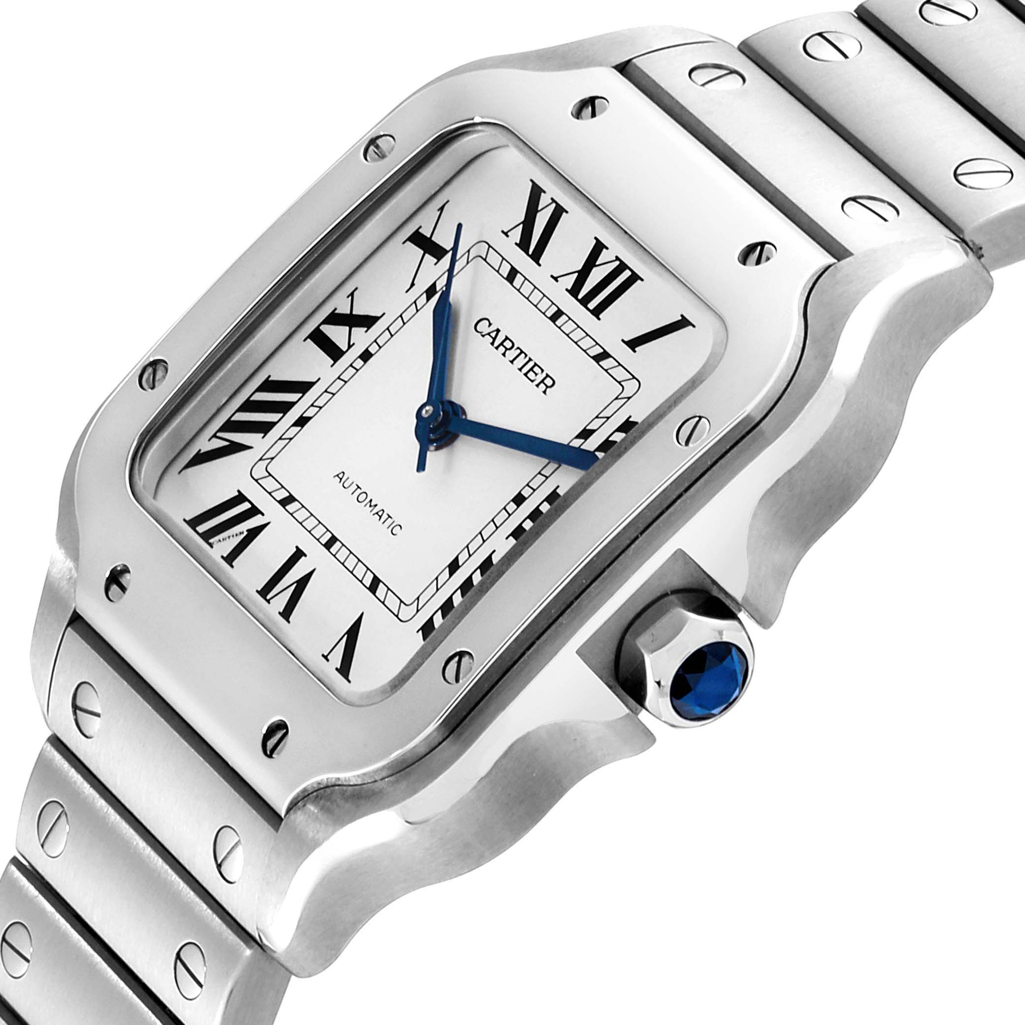 This image shows a close-up angle of the Cartier Santos WSSA0010 Men's Stainless Steel Silver Dial WSSA0010 Men's Stainless Steel Silver Dial watch face and bracelet, highlighting its Roman numeral dial and blue hands.