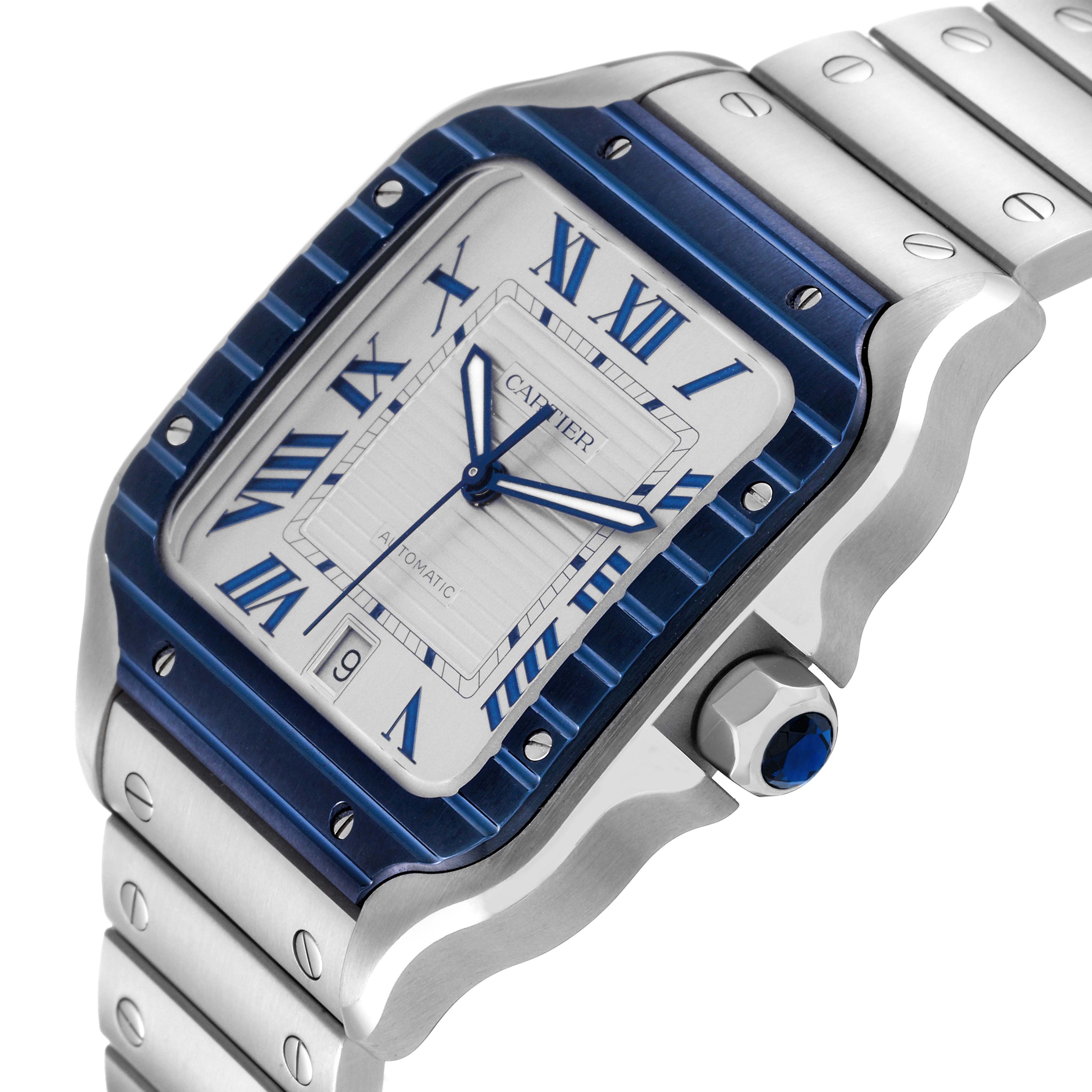 This image shows a close-up angled view of the Cartier Santos WSSA0048 Men
s Stainless Steel Silver Dial WSSA0048 Men
s Stainless Steel Silver Dial watch face, bezel, and part of the bracelet.