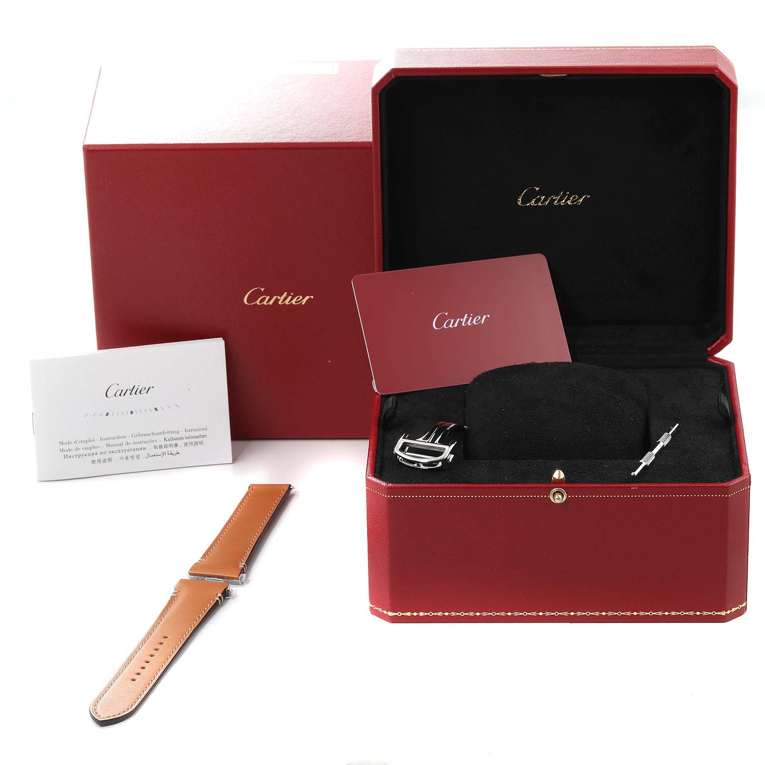 The image shows the accessories of a Cartier Santos WSSA0018 Men
s Stainless Steel Silver Dial WSSA0018 Men
s Stainless Steel Silver Dial watch, including additional straps, a warranty card, and packaging.