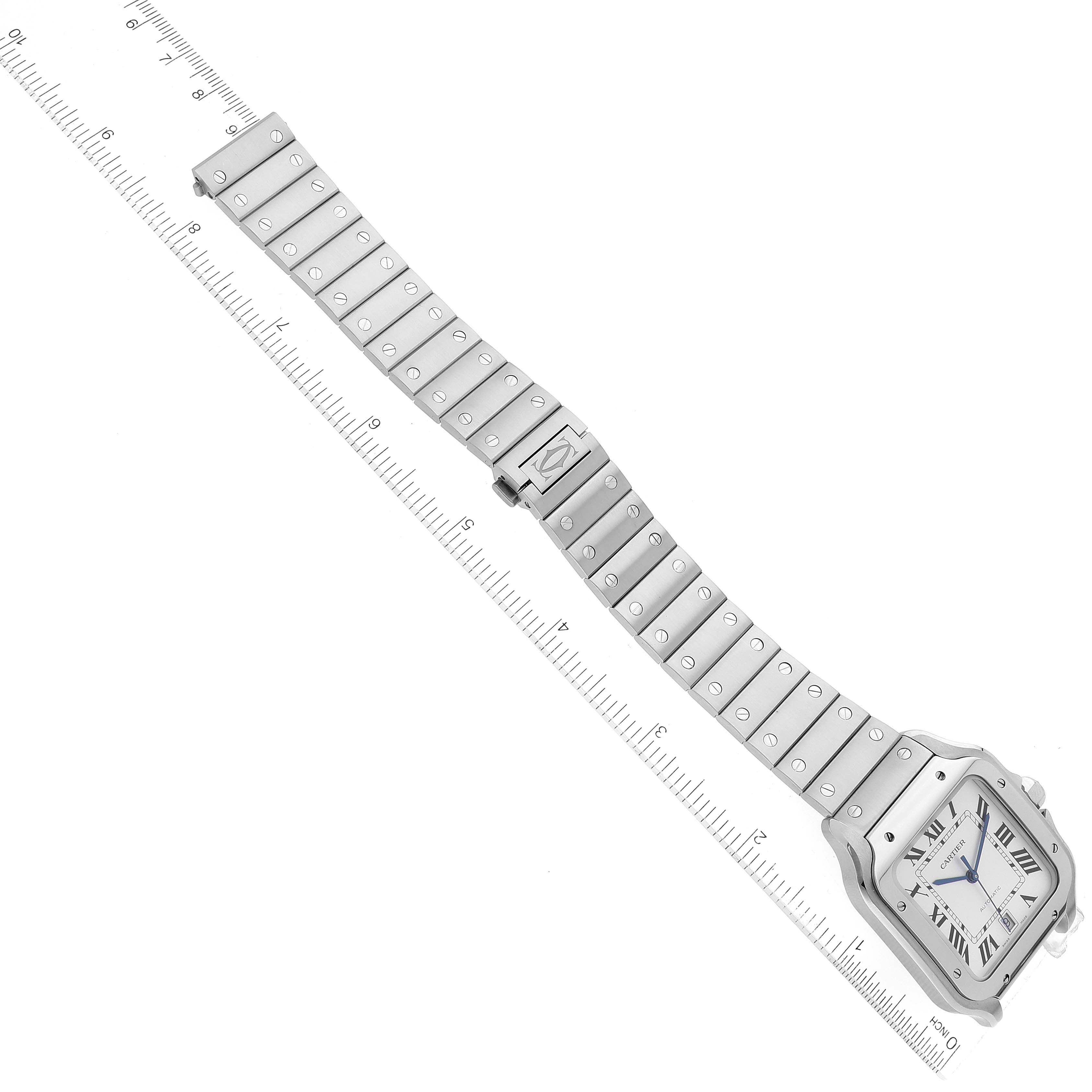The image shows an overhead view of a Cartier Santos WSSA0018 Men
s Stainless Steel Silver Dial WSSA0018 Men
s Stainless Steel Silver Dial watch, highlighting the full length of its metal bracelet and face.