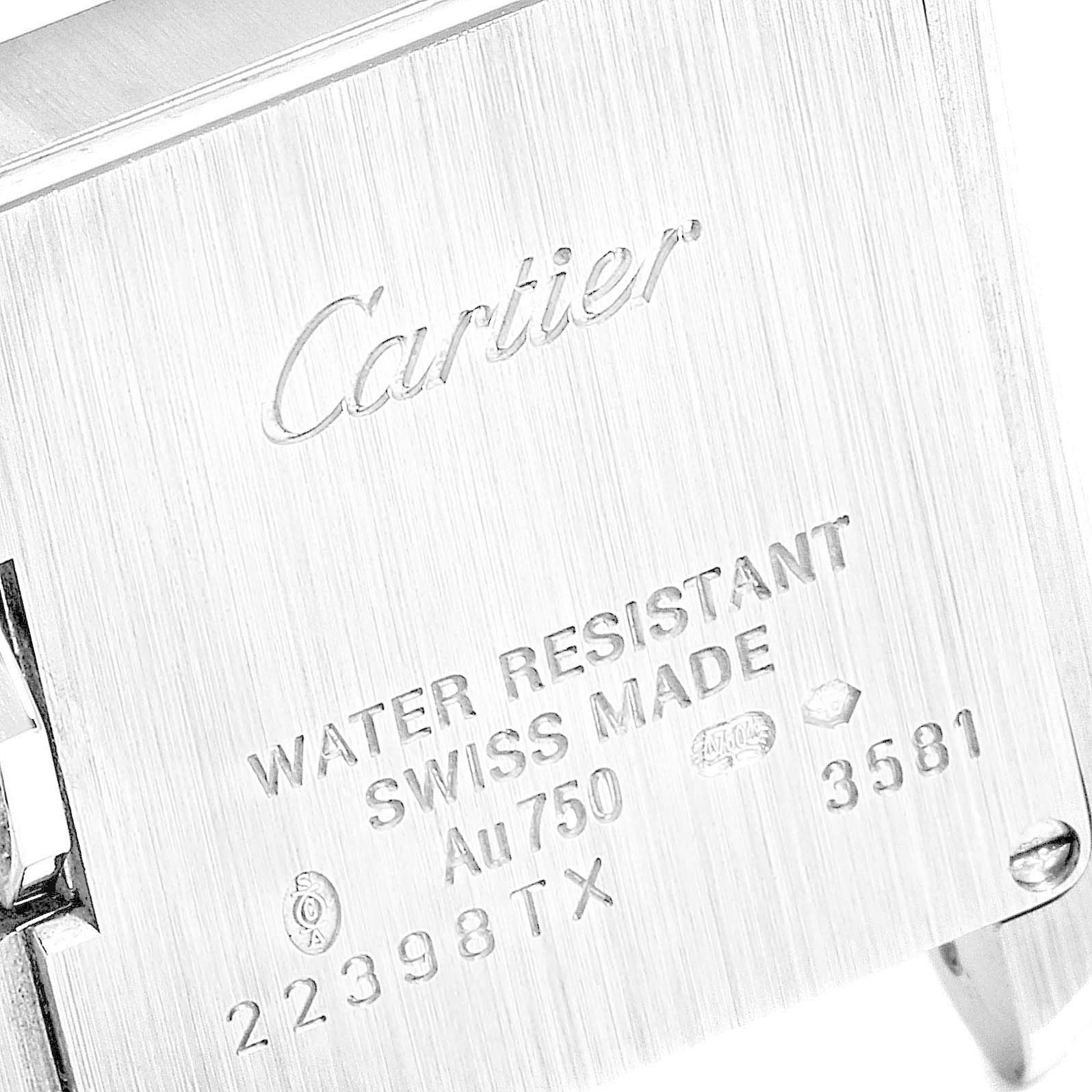 The image shows the engraved back plate of a Cartier Tank Anglaise WT100015 Women's White Gold Silver Dial WT100015 Women's White Gold Silver Dial watch, displaying its water resistance, material, and serial number.
