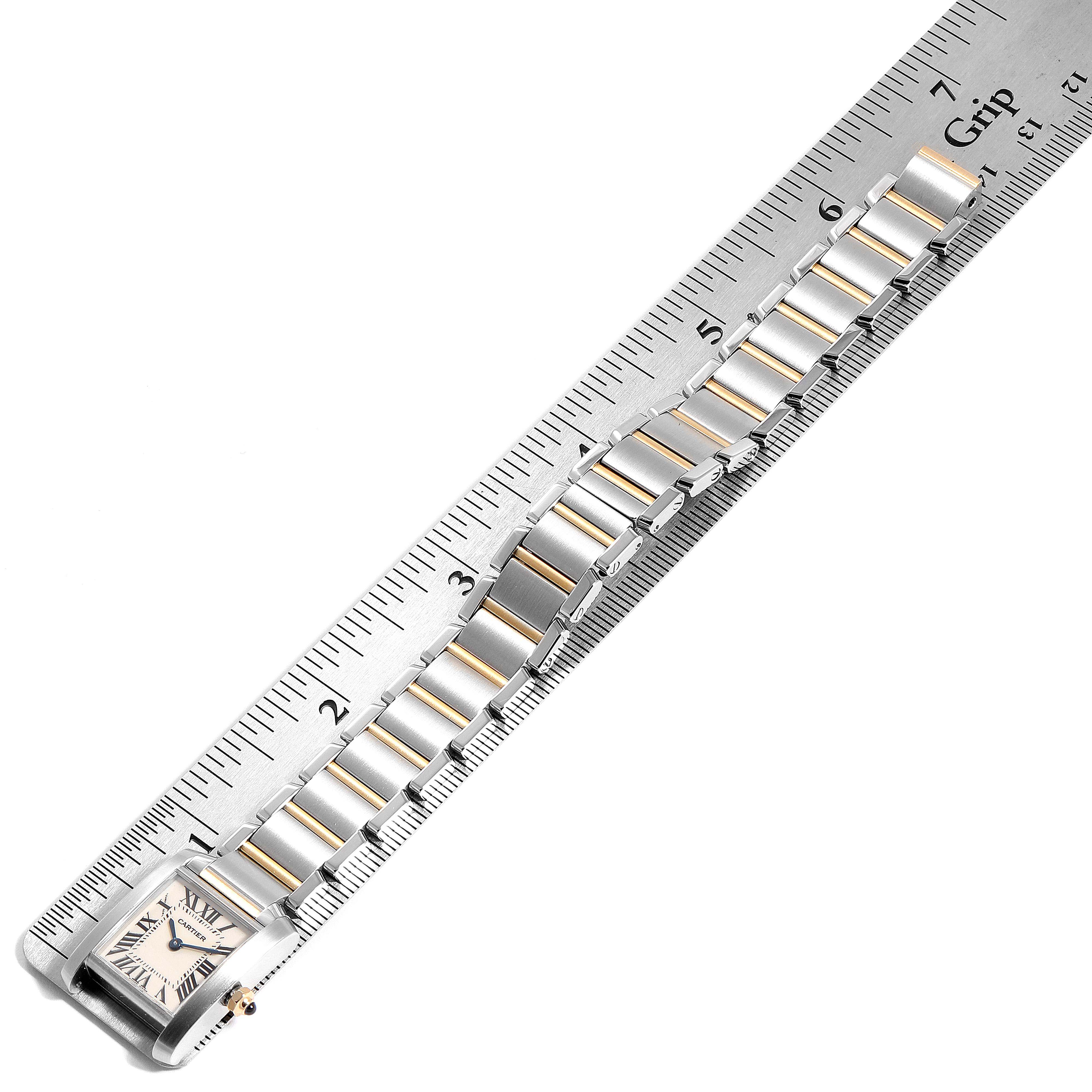 The Cartier Tank Francaise W51007Q4 Women
s Stainless Steel Silver Dial W51007Q4 Women
s Stainless Steel Silver Dial watch is shown from a top-down angle, with its bracelet measured against a ruler.