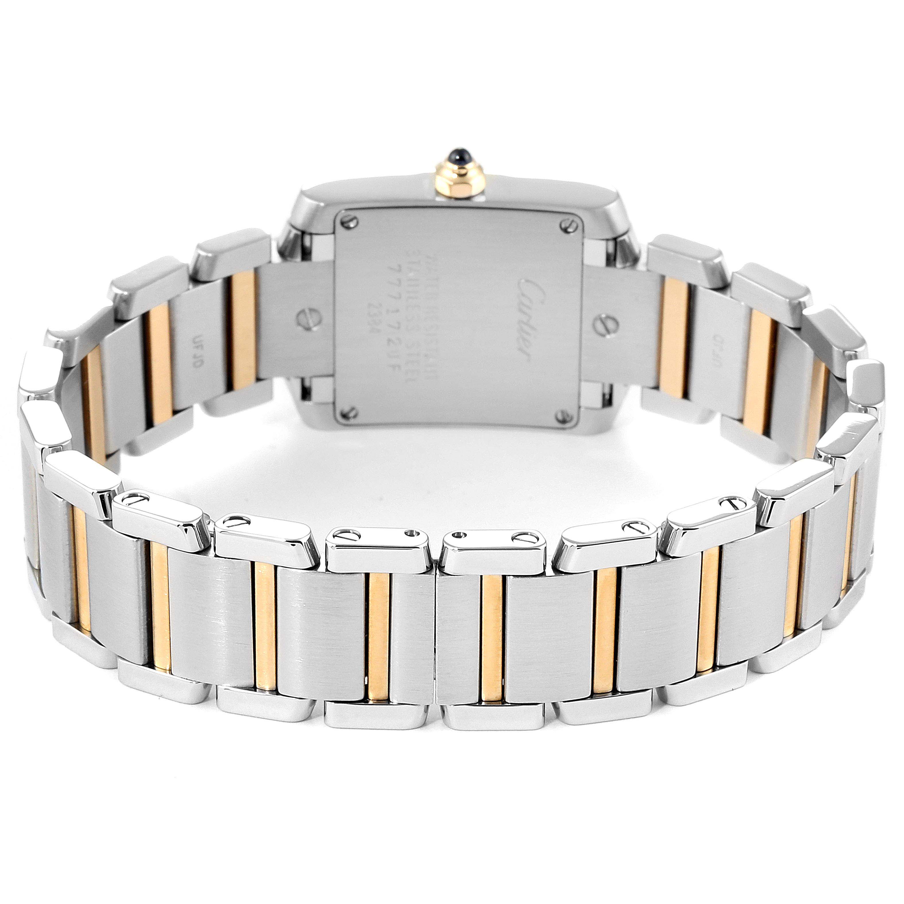 The image shows the back view of a Cartier Tank Francaise W51007Q4 Women
s Stainless Steel Silver Dial W51007Q4 Women
s Stainless Steel Silver Dial watch, highlighting its stainless steel and gold bracelet and rear case.