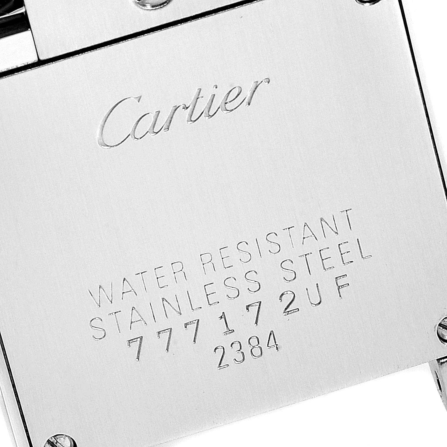 The image shows the back case of a Cartier Tank Francaise W51007Q4 Women
s Stainless Steel Silver Dial W51007Q4 Women
s Stainless Steel Silver Dial watch, highlighting the engraved details and screws.