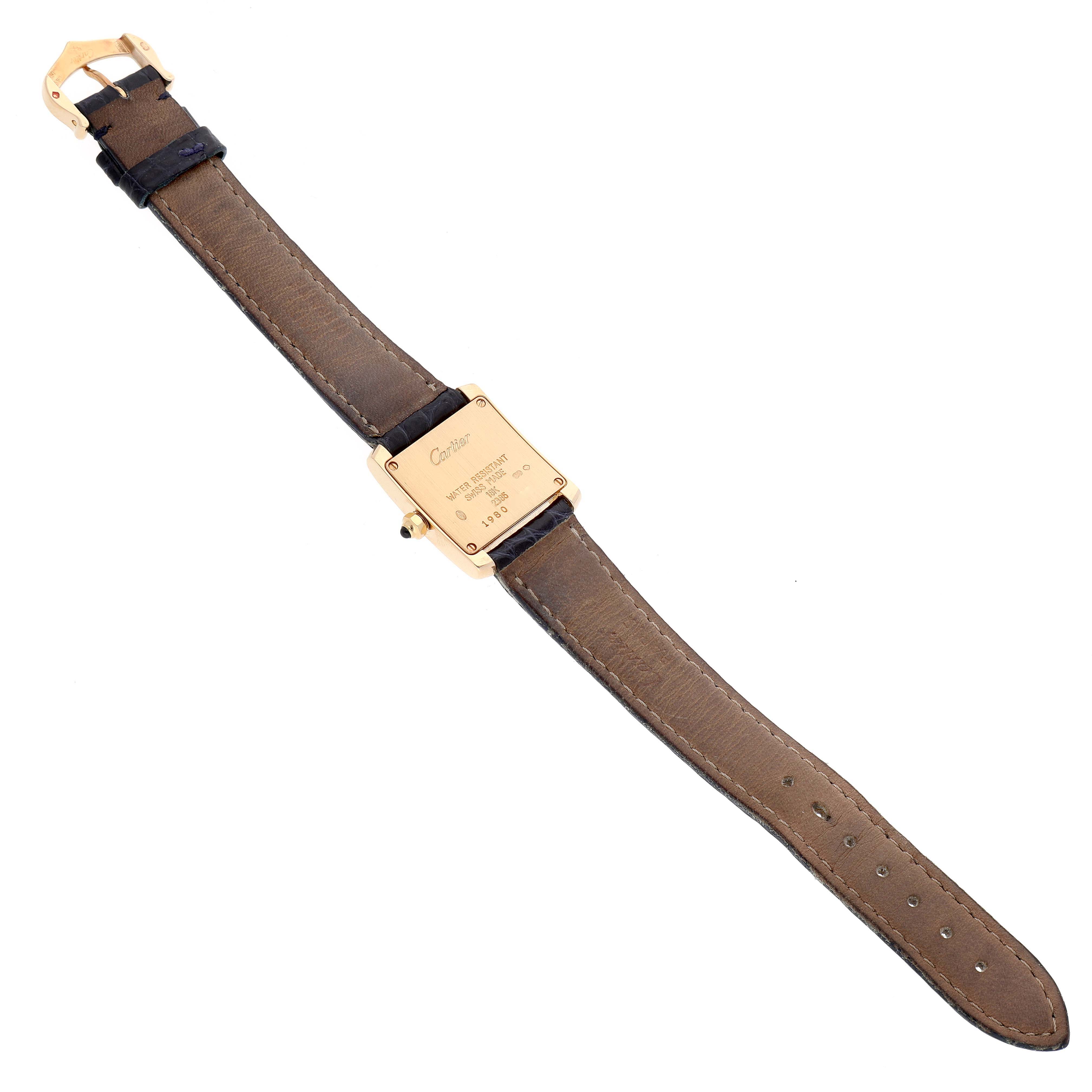 This image shows the back view of a Cartier Tank Française watch, including the strap, buckle, and caseback.