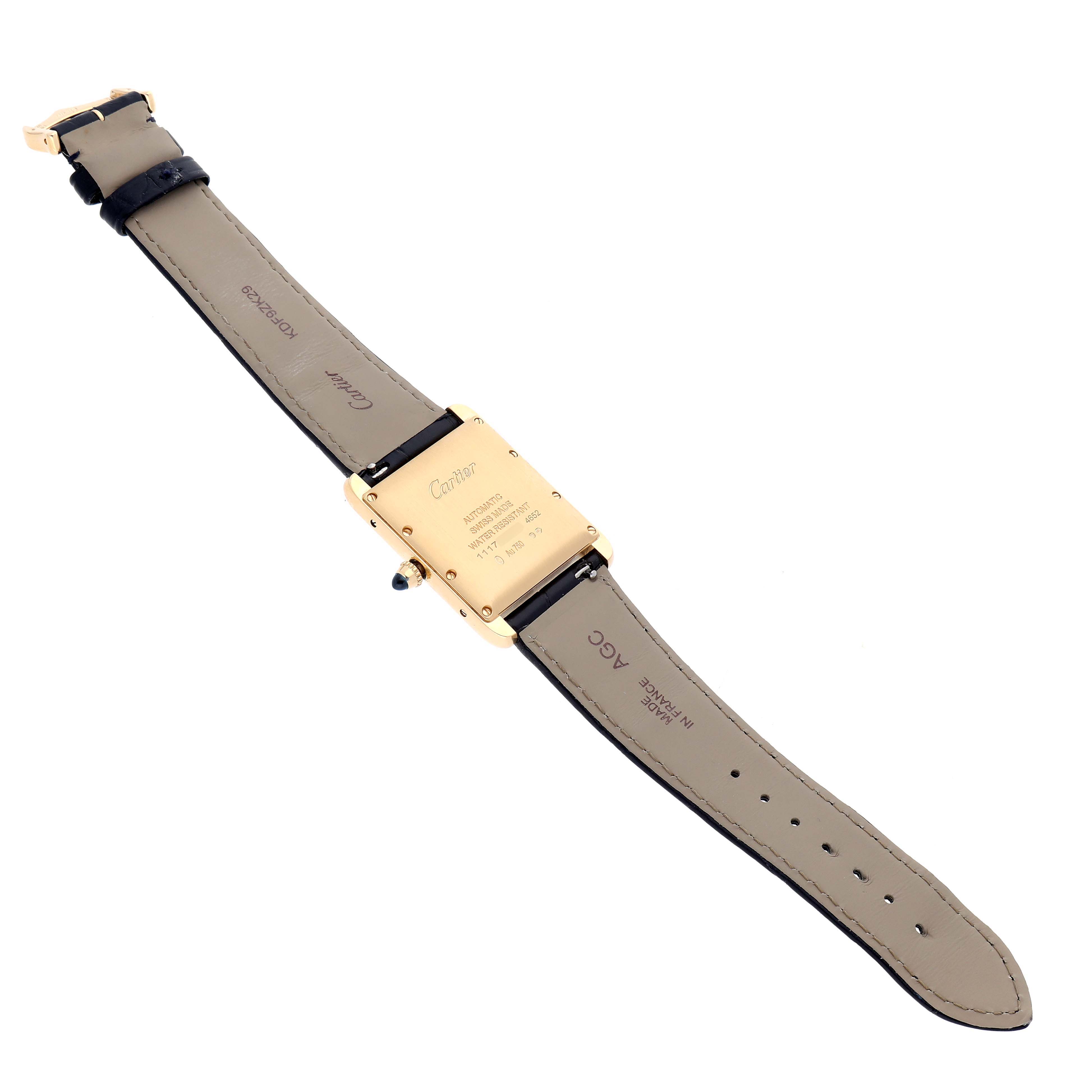The Cartier Tank Louis WGTA0357 Men's Yellow Gold Silver Dial watch is shown from the back, highlighting the case back, leather strap, and buckle.