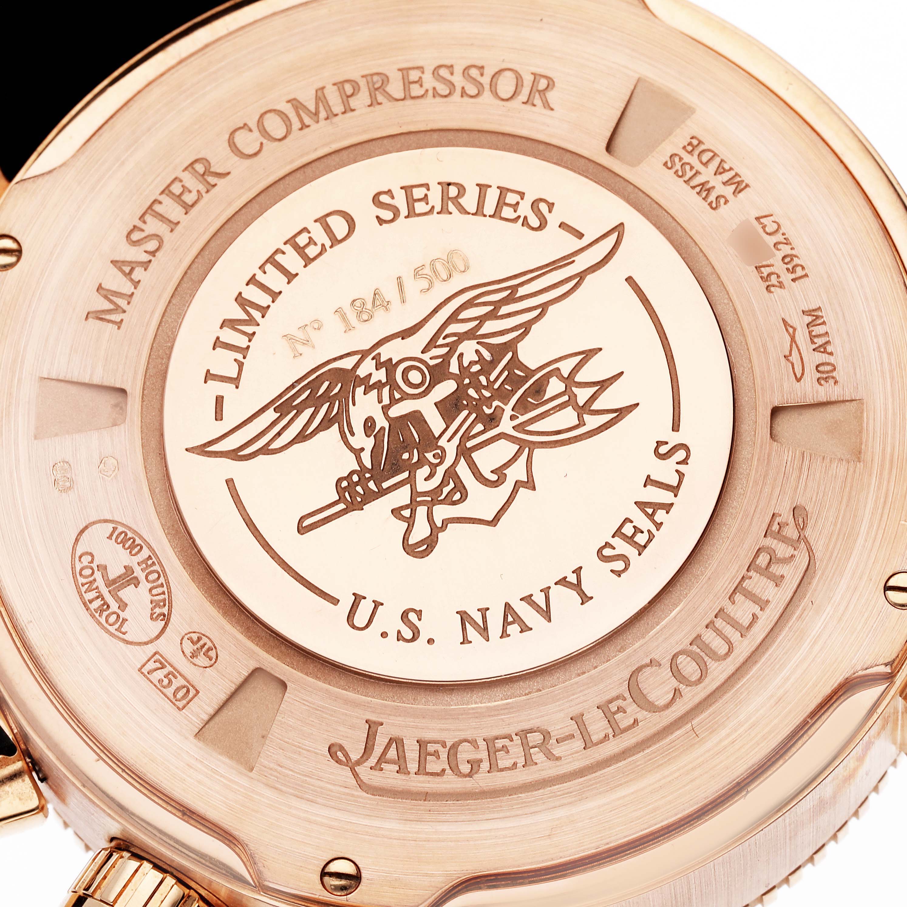 The image shows the case back of the Jaeger-LeCoultre Master Compressor watch, highlighting its limited series number and U.S. Navy SEALS insignia.