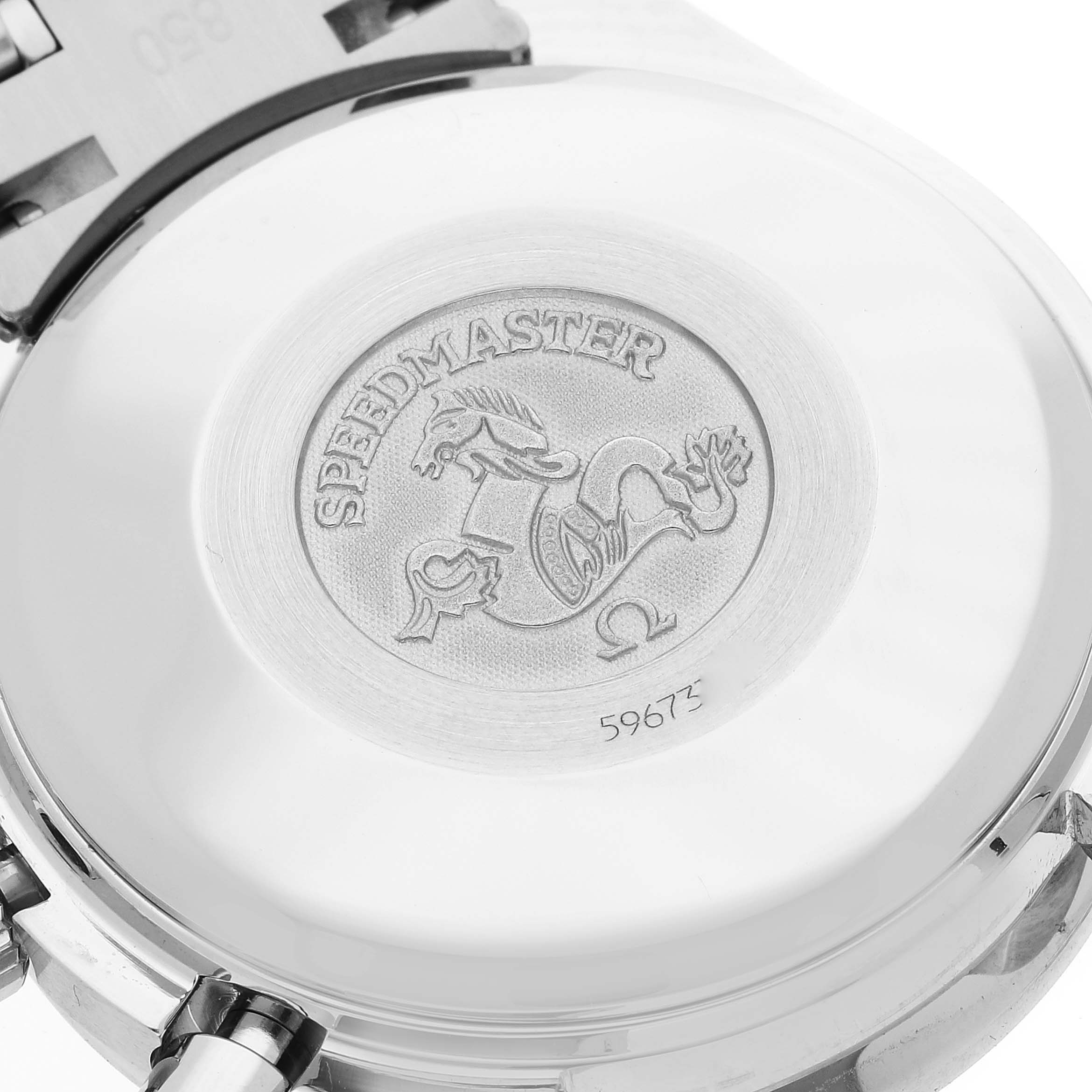 The image shows the case back of an Omega Speedmaster 3513.54.00 Men
s Stainless Steel Black Dial 3513.54.00 Men
s Stainless Steel Black Dial watch, highlighting the engraved logo and serial number.