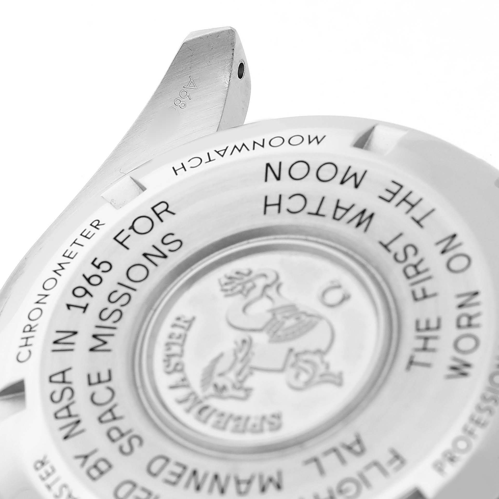 The image shows the case back of an Omega Speedmaster 310.30.42.50.01.001 Men's Stainless Steel Black Dial, featuring engraved text and the emblem in the center.