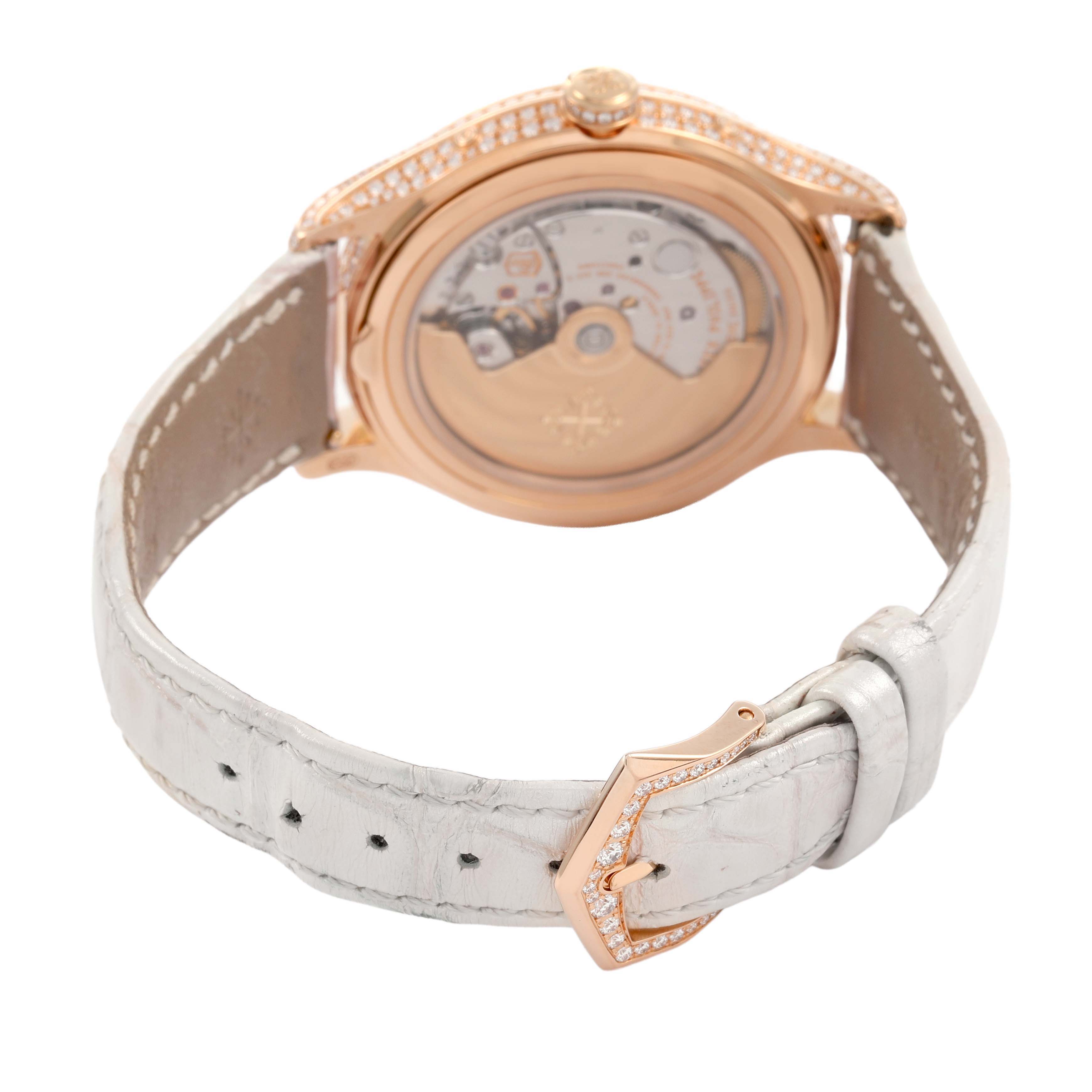 The image shows the back view of a Patek Philippe Complications 4948R-001 Women's Rose Gold Mother of Pearl Dial watch, highlighting the movement and leather strap.