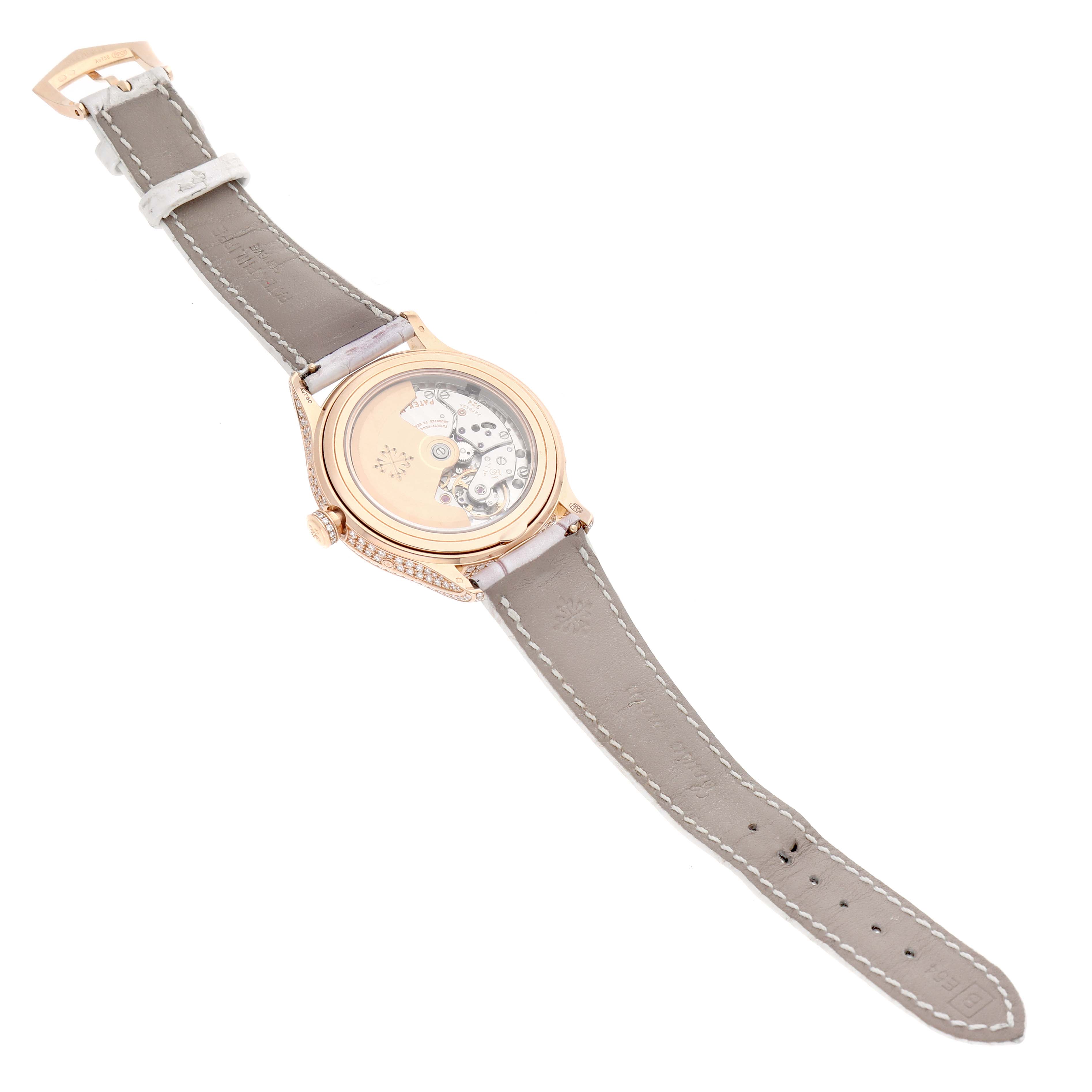 The image shows the back view of a Patek Philippe Complications 4948R-001 Women's Rose Gold Mother of Pearl Dial watch, highlighting its transparent case back and leather strap.