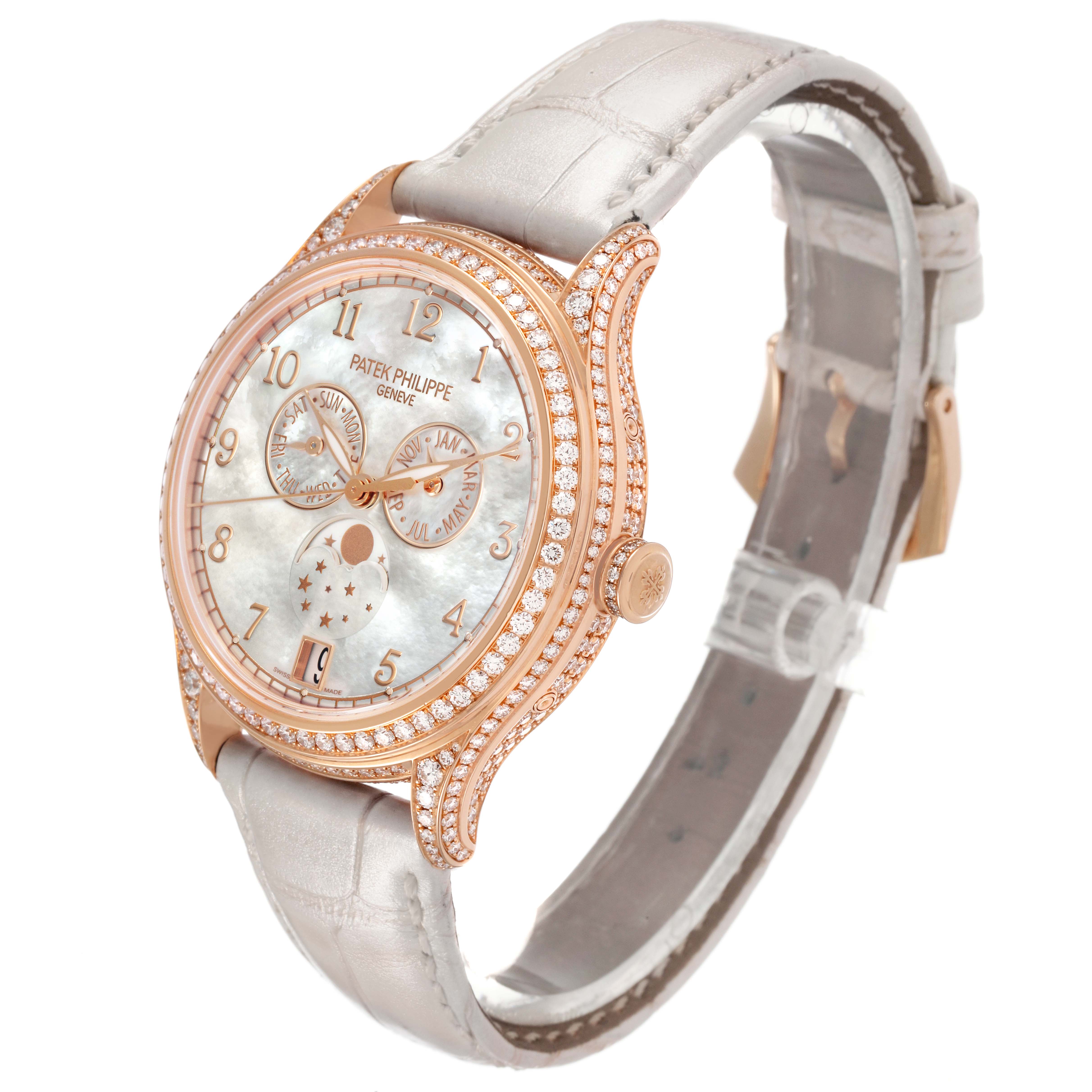 The Patek Philippe Complications 4948R-001 Women's Rose Gold Mother of Pearl Dial watch is shown at a three-quarter angle, highlighting the diamond-studded bezel and mother-of-pearl dial.
