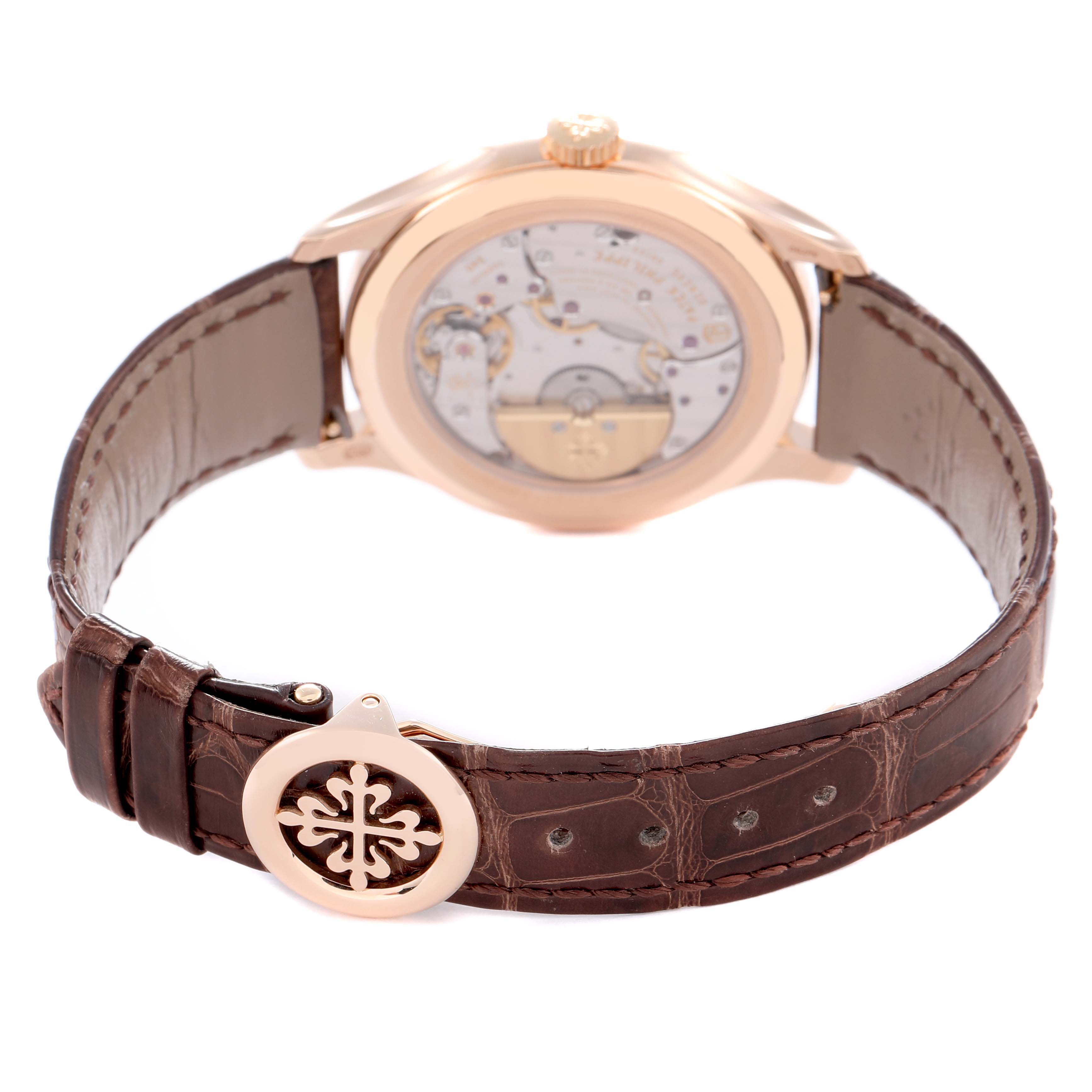 The image shows the back view of a Patek Philippe Complications 5327R Men
s Rose Gold White Dial 5327R Men
s Rose Gold White Dial watch, highlighting the movement and leather strap detail.