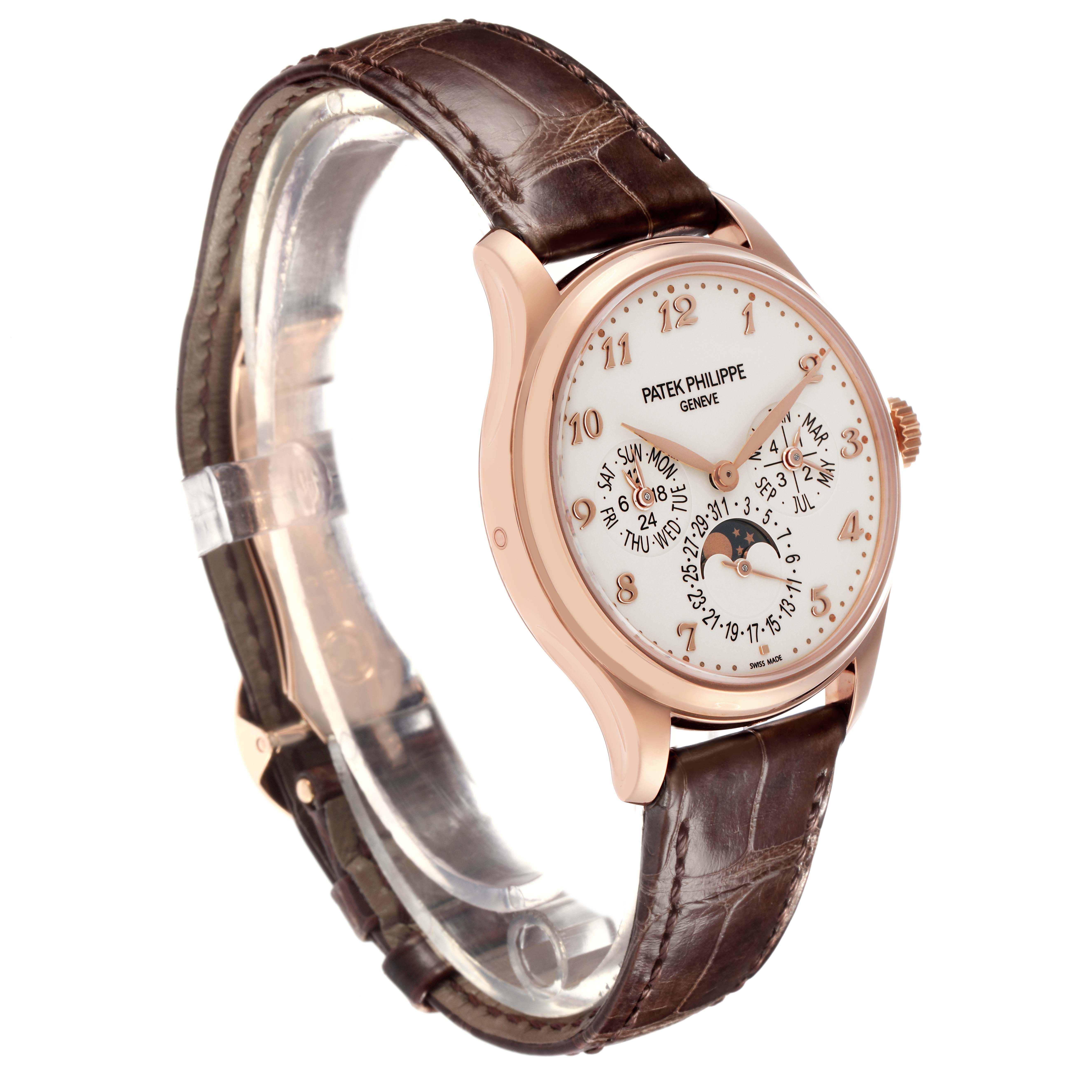 The Patek Philippe Complications 5327R Men
s Rose Gold White Dial 5327R Men
s Rose Gold White Dial watch is shown at a 3/4 angle, highlighting the dial, case, and leather strap.