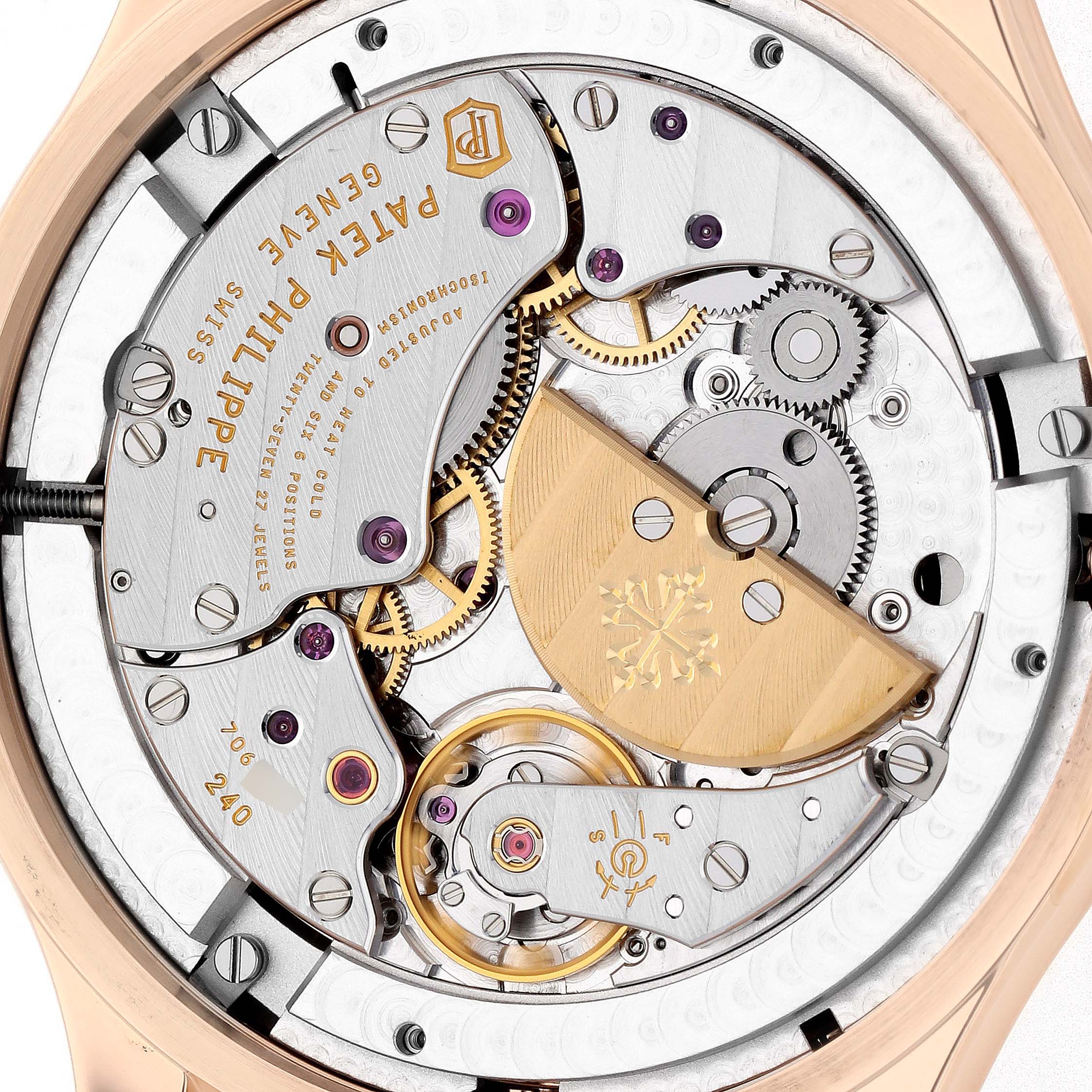 The image shows the back view of the movement of a Patek Philippe Complications 5327R Men
s Rose Gold White Dial 5327R Men
s Rose Gold White Dial watch, highlighting gears, jewels, and the rotor.