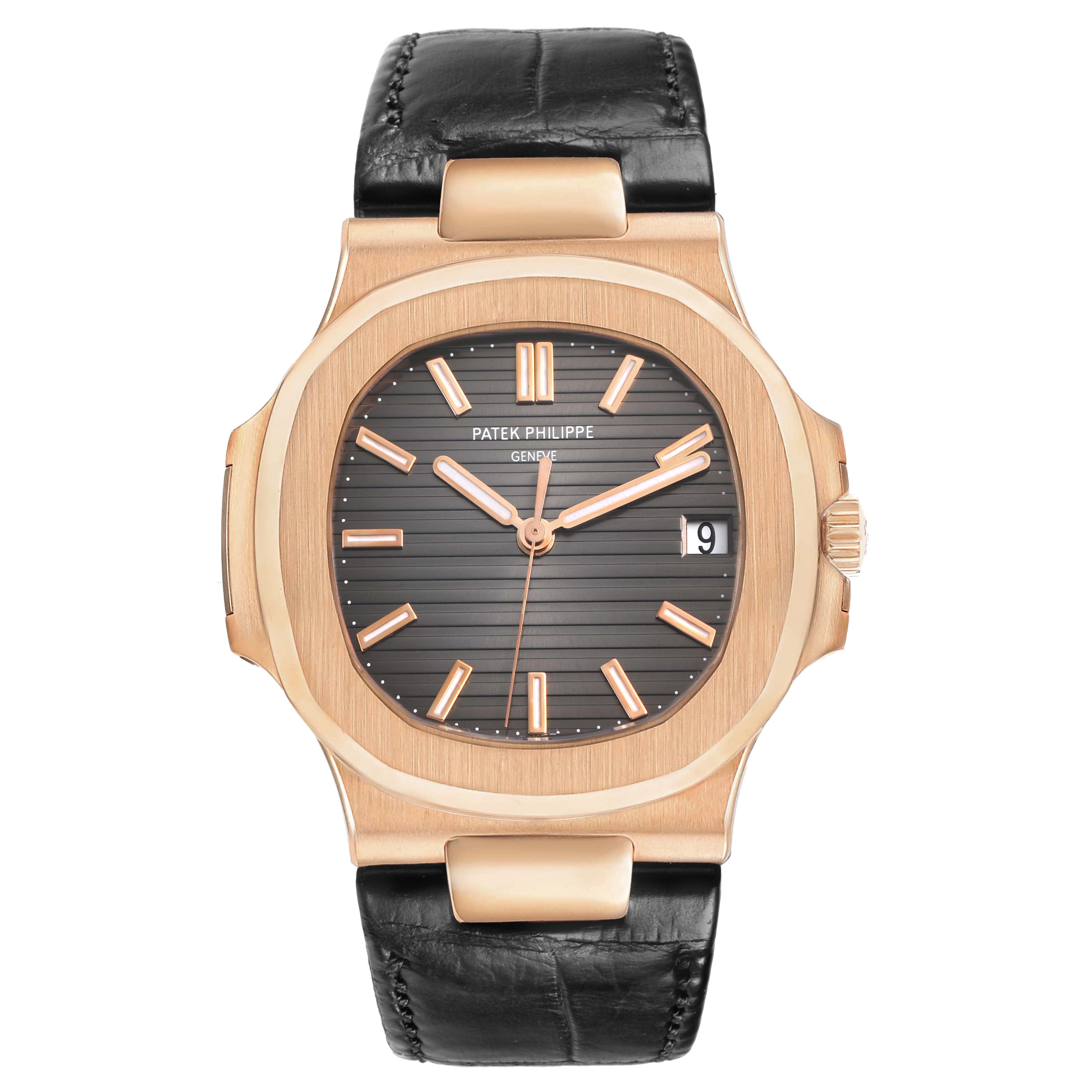 The image shows a front view of a Patek Philippe Nautilus 5711R-001 Men's Rose Gold Grey Dial watch, highlighting its brown dial, gold hour markers, and black leather strap.
