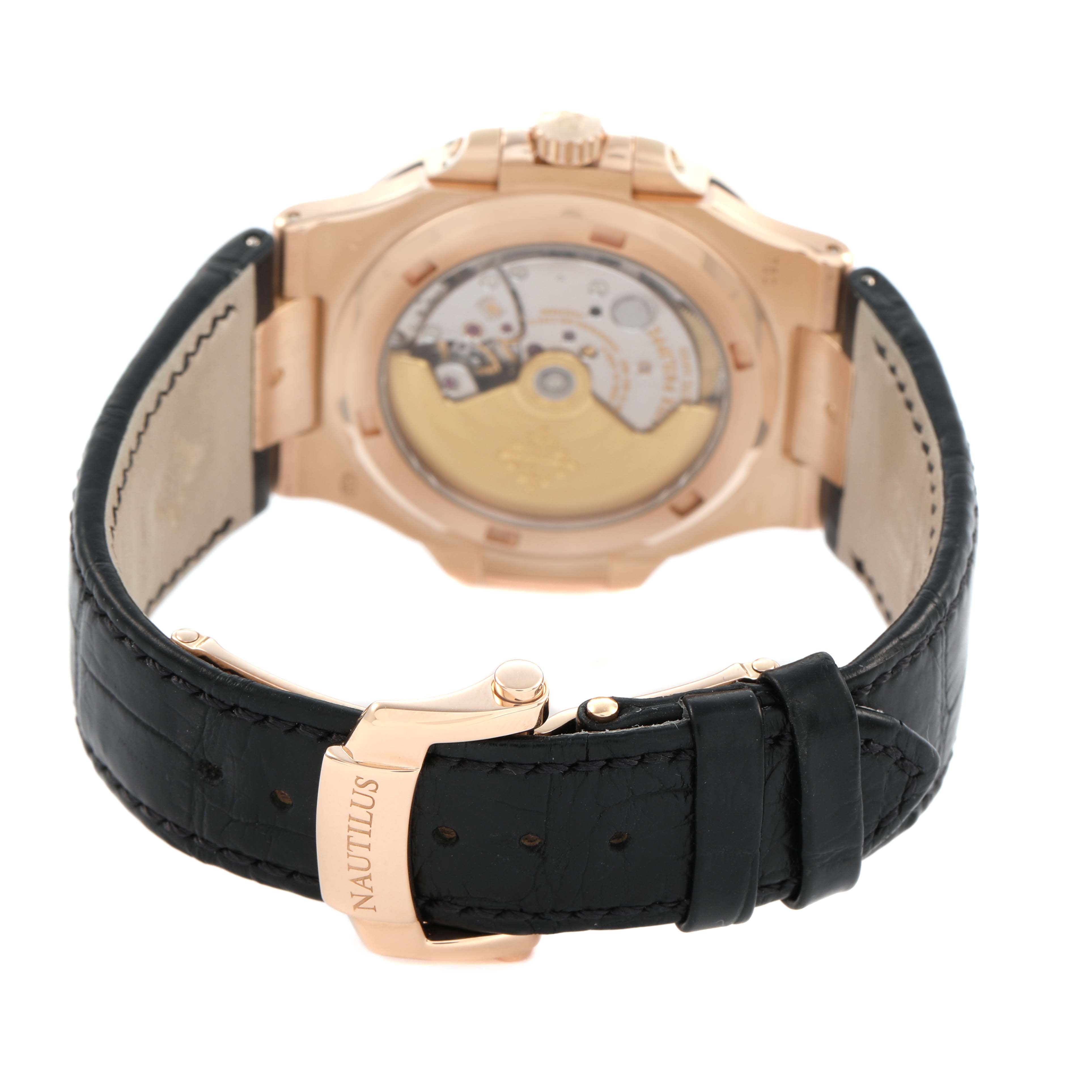 The image shows the back of a Patek Philippe Nautilus 5711R-001 Men's Rose Gold Grey Dial watch, highlighting the movement, case back, and leather strap with clasp.