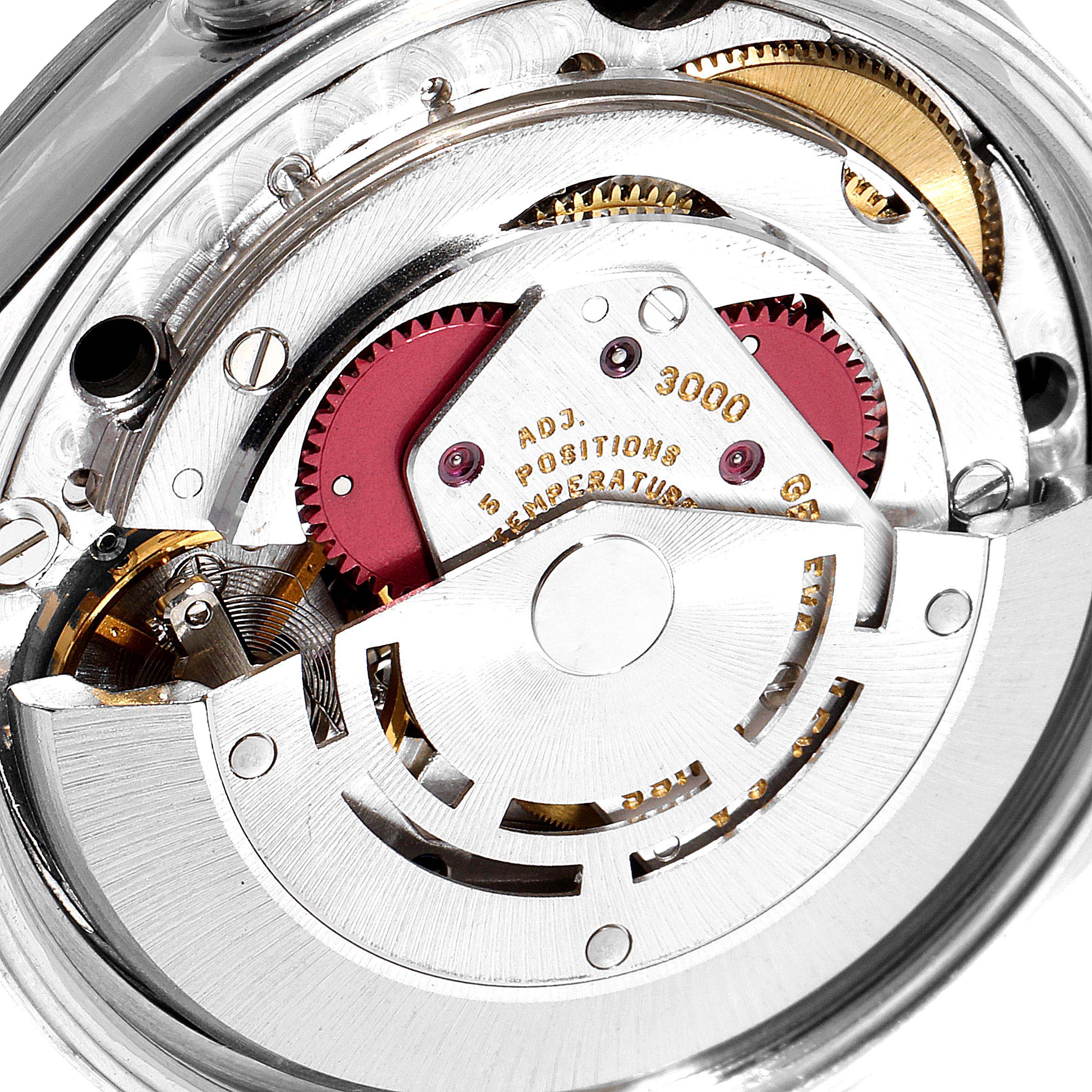 Close-up view of the Rolex Air-King 14000 Men's Stainless Steel Black Dial 14000 Men's Stainless Steel Black Dial watch movement, showcasing intricate gears and components from a top-angle perspective.