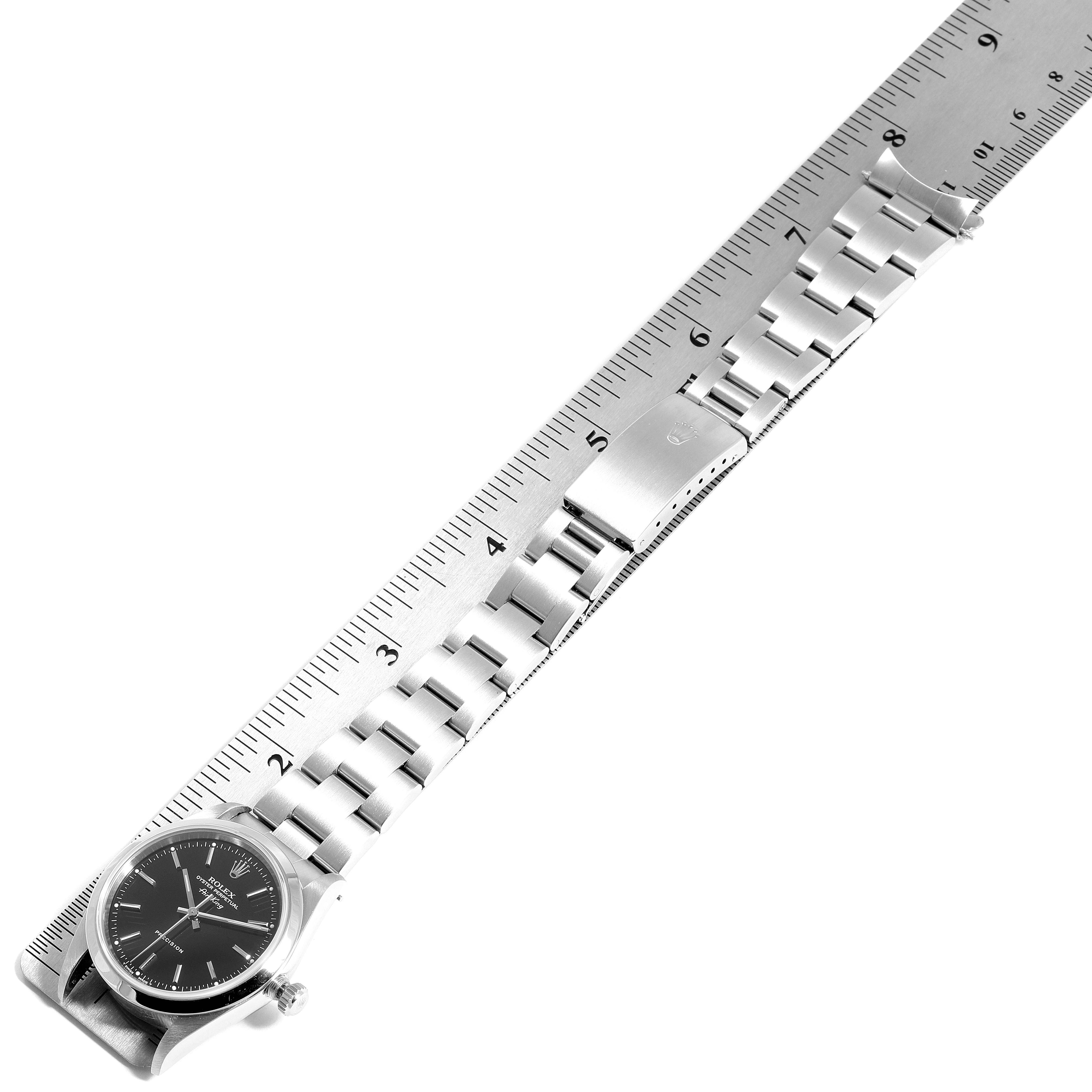The image shows a top-down view of the Rolex Air-King 14000 Men's Stainless Steel Black Dial 14000 Men's Stainless Steel Black Dial watch and its stainless steel bracelet measured against a ruler.