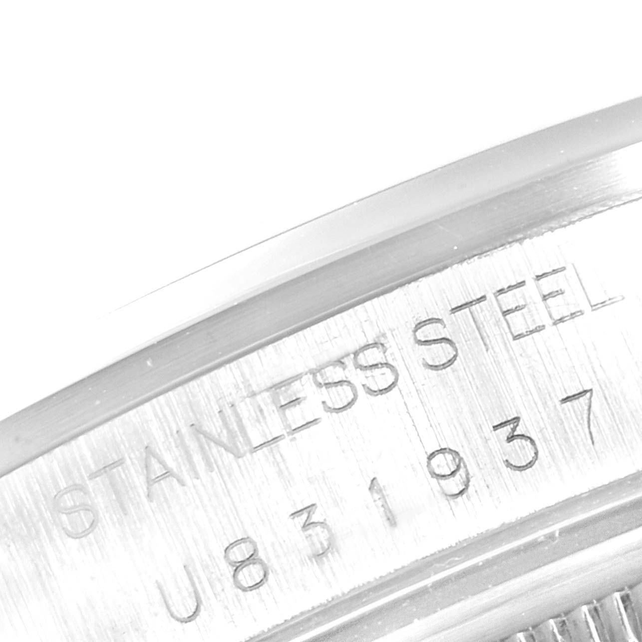 The image shows a close-up of the stainless steel casing and serial number on a Rolex Air-King 14000 Men's Stainless Steel Silver Dial 14000 Men's Stainless Steel Silver Dial watch.