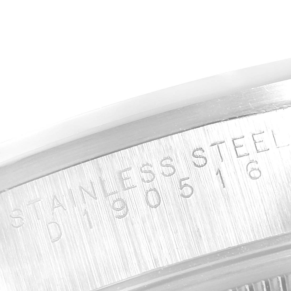 This image shows a close-up angled view of the stainless steel back with engravings on a Rolex Air-King 14000 Men's Stainless Steel Silver Dial 14000 Men's Stainless Steel Silver Dial watch.
