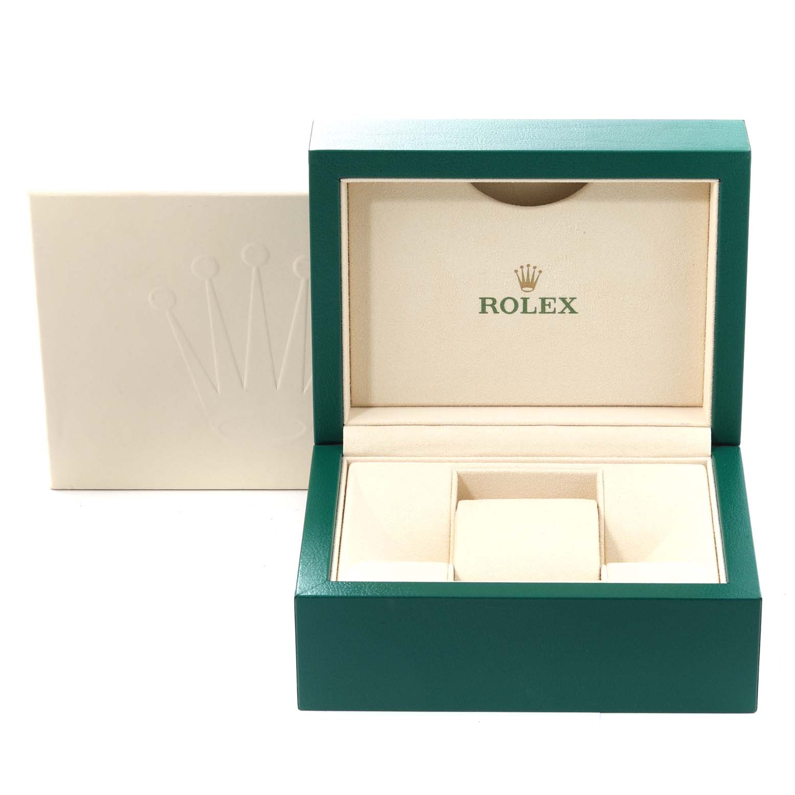 The image shows an open Rolex watch box for the Oyster Perpetual model, featuring a green exterior and cream interior.