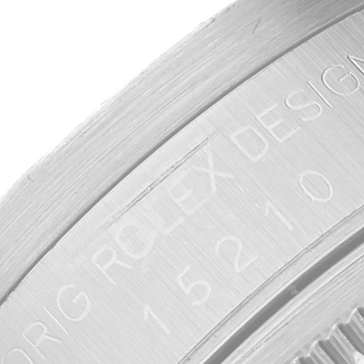 The image shows a close-up of the case engravings on a Rolex Date 15210 Men's Stainless Steel Black Dial 15210 Men's Stainless Steel Black Dial model watch.