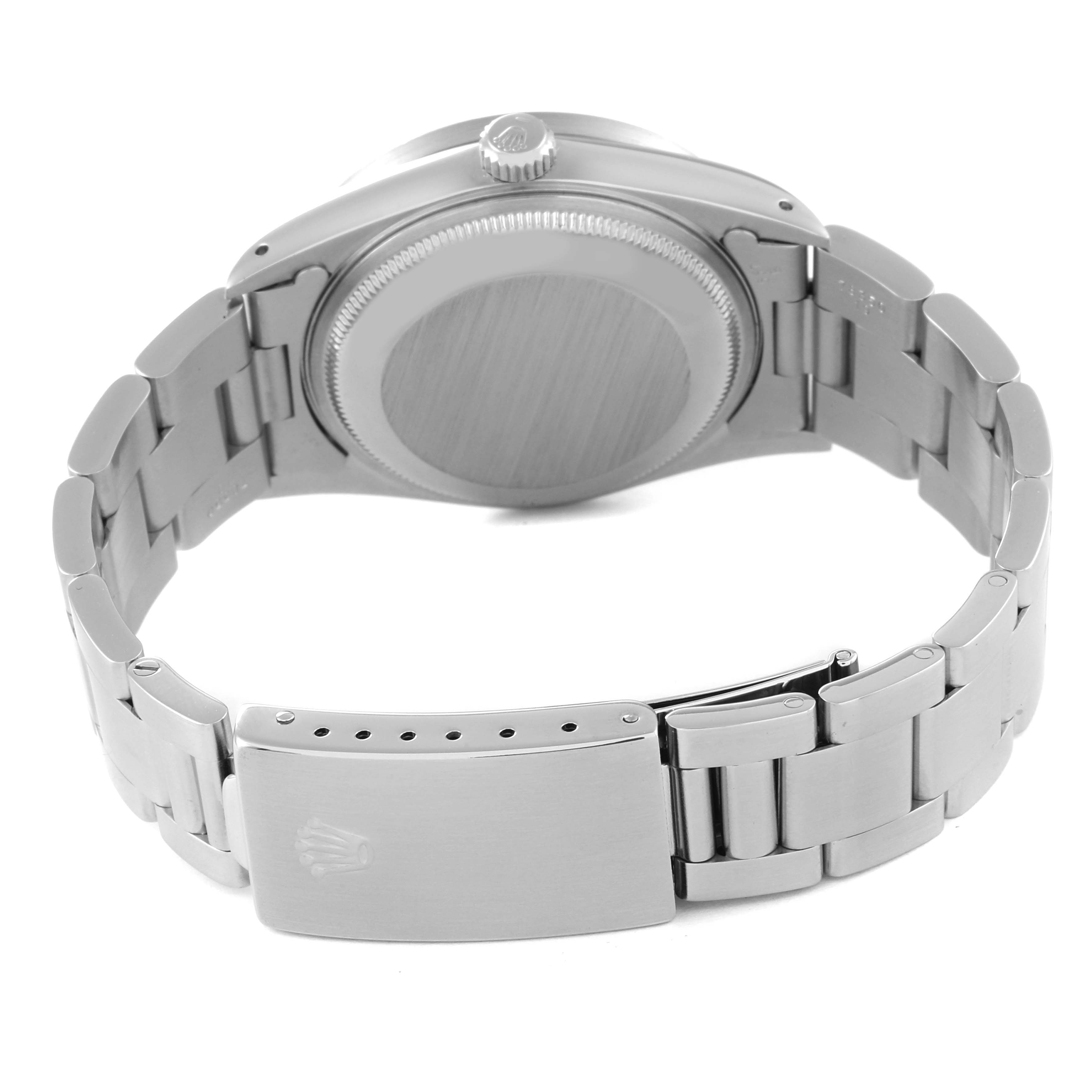 This image shows the back view of a Rolex Date 15210 Men's Stainless Steel Black Dial 15210 Men's Stainless Steel Black Dial model watch, highlighting its stainless steel case and bracelet clasp.