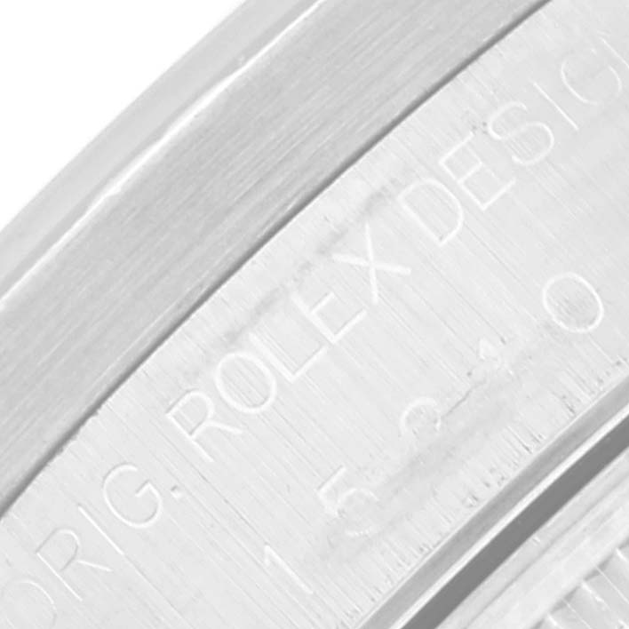 This image shows a close-up of the engraved side of the case of a Rolex Date 15210 Men's Stainless Steel Black Dial 15210 Men's Stainless Steel Black Dial model watch.
