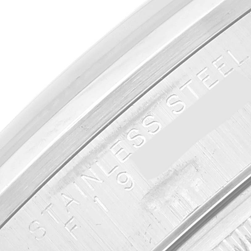 This image shows a close-up of the stainless steel case back edge of a Rolex Date 15200 Men's Stainless Steel Black Dial 15200 Men's Stainless Steel Black Dial watch.