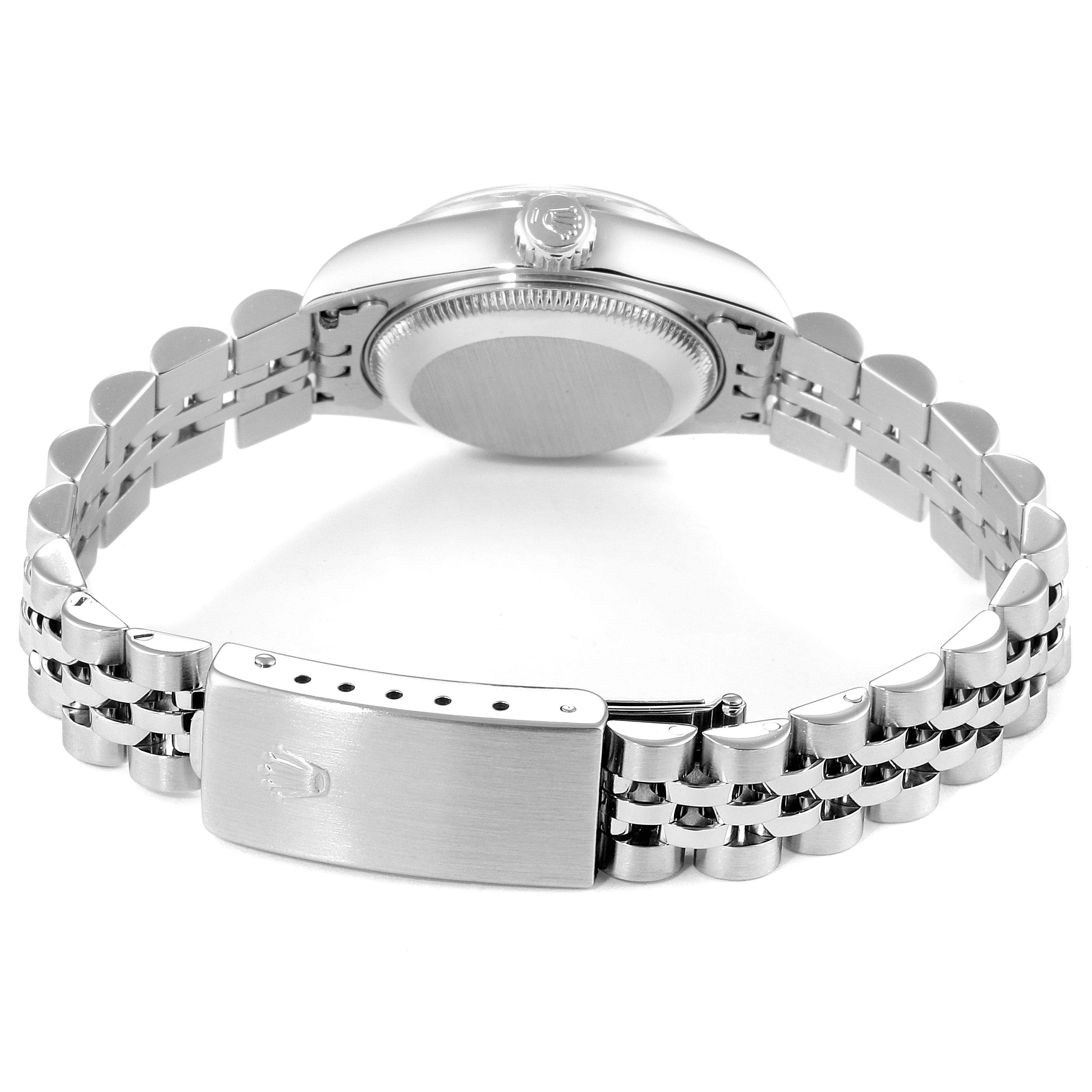 This image shows the backside of a Rolex Datejust 69240  Women's Stainless Steel Blue Dial 69240  Women's Stainless Steel Blue Dial watch, highlighting its caseback, crown, and Jubilee bracelet with clasp.