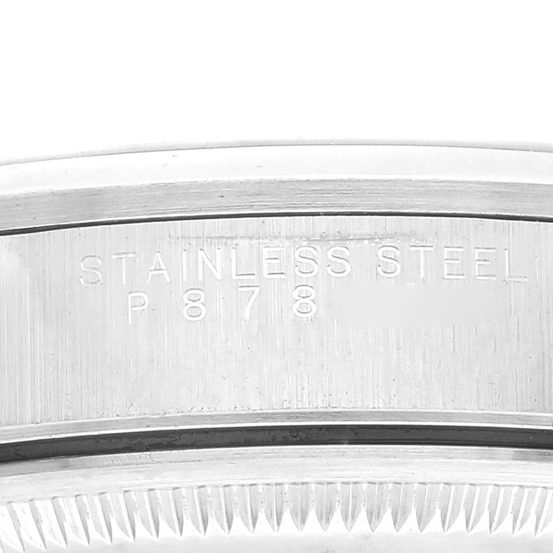 This close-up image shows the side of a Rolex Date 15200 Men's Stainless Steel Blue Dial 15200 Men's Stainless Steel Blue Dial watch, focusing on the engraved "STAINLESS STEEL" marking.