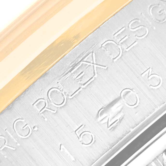 The image shows a close-up of a Rolex Date 15203 Men's Steel and Gold (two tone) Champagne Dial 15203 Men's Steel and Gold (two tone) Champagne Dial model watch with a visible engraved bezel.